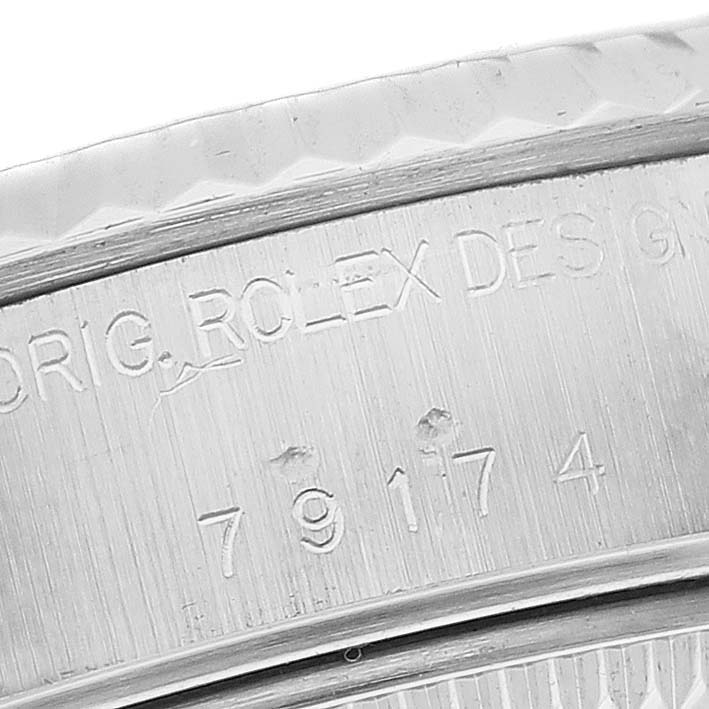 The image shows a close-up of the case back engraving of a Rolex Datejust 79174 Women's Stainless Steel Mother of Pearl Dial 79174 Women's Stainless Steel Mother of Pearl Dial watch, highlighting the model number.
