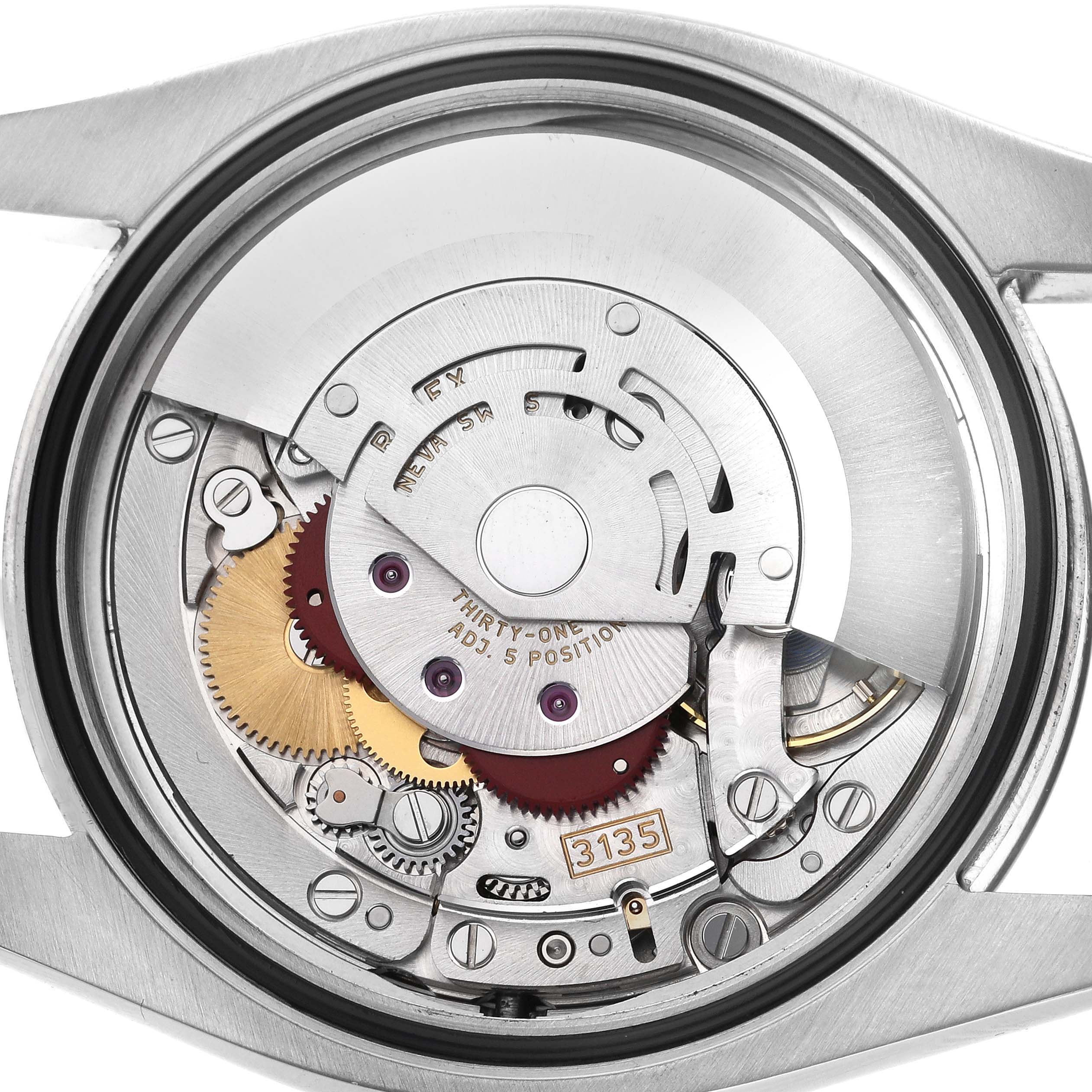 The image shows the back view of the Rolex Datejust 116234 Men's Stainless Steel Blue Dial 116234 Men's Stainless Steel Blue Dial watch, focusing on its intricate movement and inner mechanics.