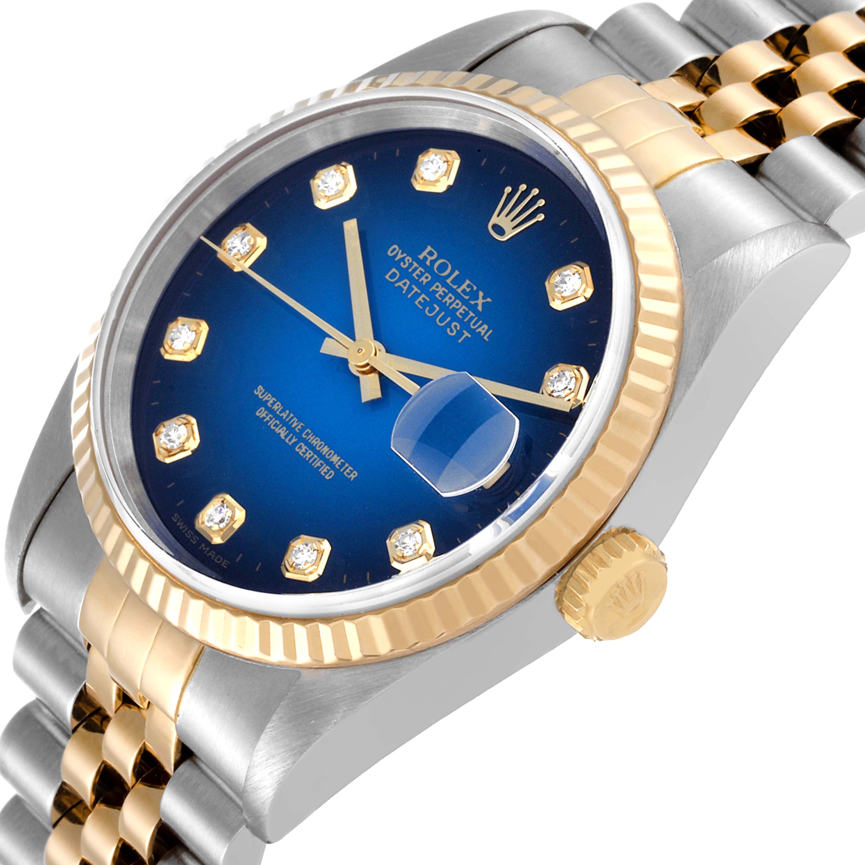 This image shows a close-up angle of a Rolex Datejust 16233 Men's Steel and Gold (two tone) Blue Dial 16233 Men's Steel and Gold (two tone) Blue Dial watch, highlighting its blue dial, gold bezel, and two-tone bracelet.