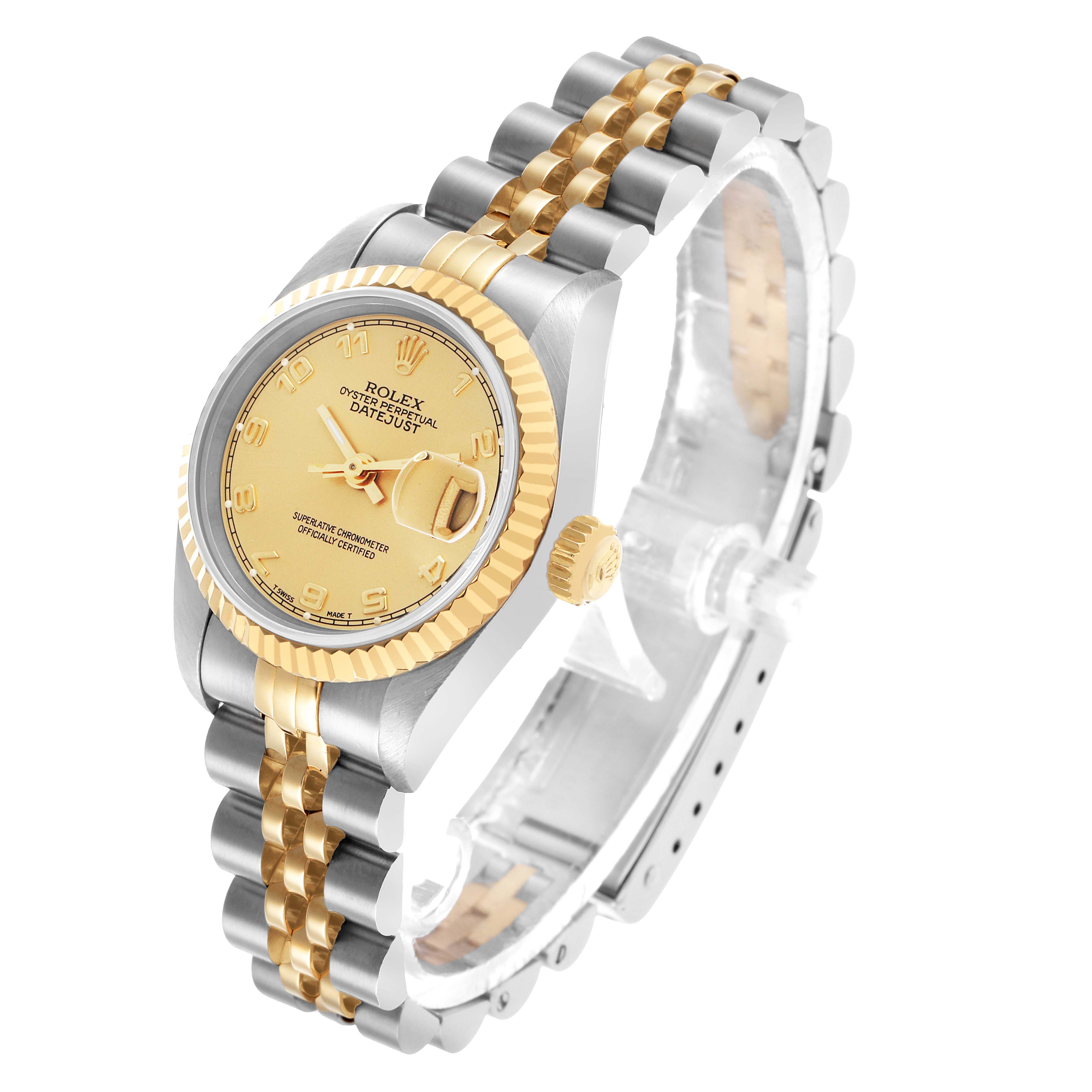 The Rolex Datejust 69173 Women's Steel and Gold (two tone) Champagne Dial watch is shown at a three-quarter angle, highlighting the face, bezel, crown, and two-tone bracelet.