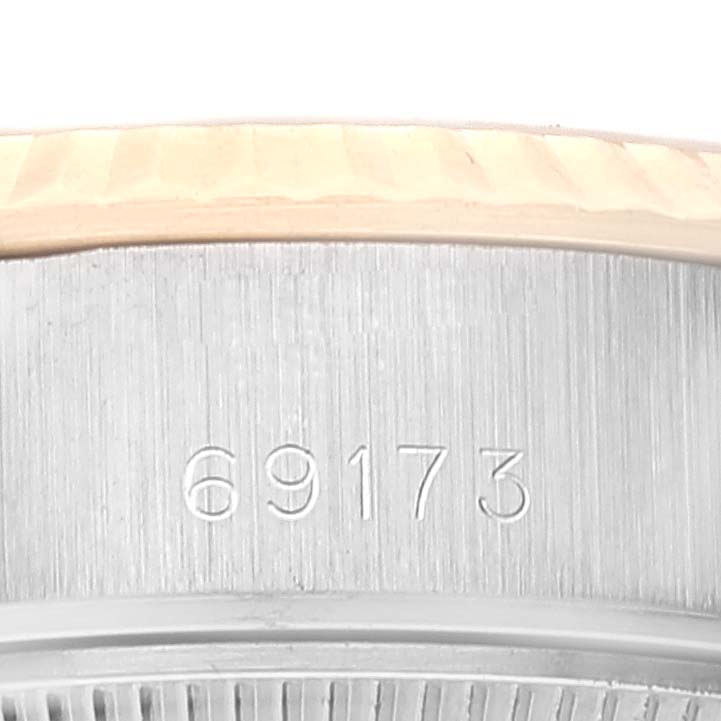 This close-up image shows the model number engraving (69173) on the case and part of the smooth bezel of a Rolex Datejust 69173 Women's Steel and Gold (two tone) Champagne Dial 69173 Women's Steel and Gold (two tone) Champagne Dial watch.