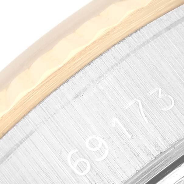 This image shows a close-up of the case back and serial number of a Rolex Datejust 69173 Women's Steel and Gold (two tone) Champagne Dial 69173 Women's Steel and Gold (two tone) Champagne Dial watch.