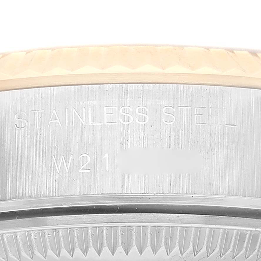 This image shows a close-up angle of the engraving on the side of the case of a Rolex Datejust 69173 Women's Steel and Gold (two tone) Champagne Dial 69173 Women's Steel and Gold (two tone) Champagne Dial made of stainless steel.