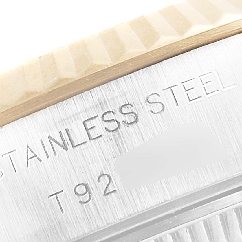 The image shows a close-up view of the stainless steel back and edge of a Rolex Datejust 69173 Women
s Steel and Gold (two tone) Champagne Dial 69173 Women
s Steel and Gold (two tone) Champagne Dial.