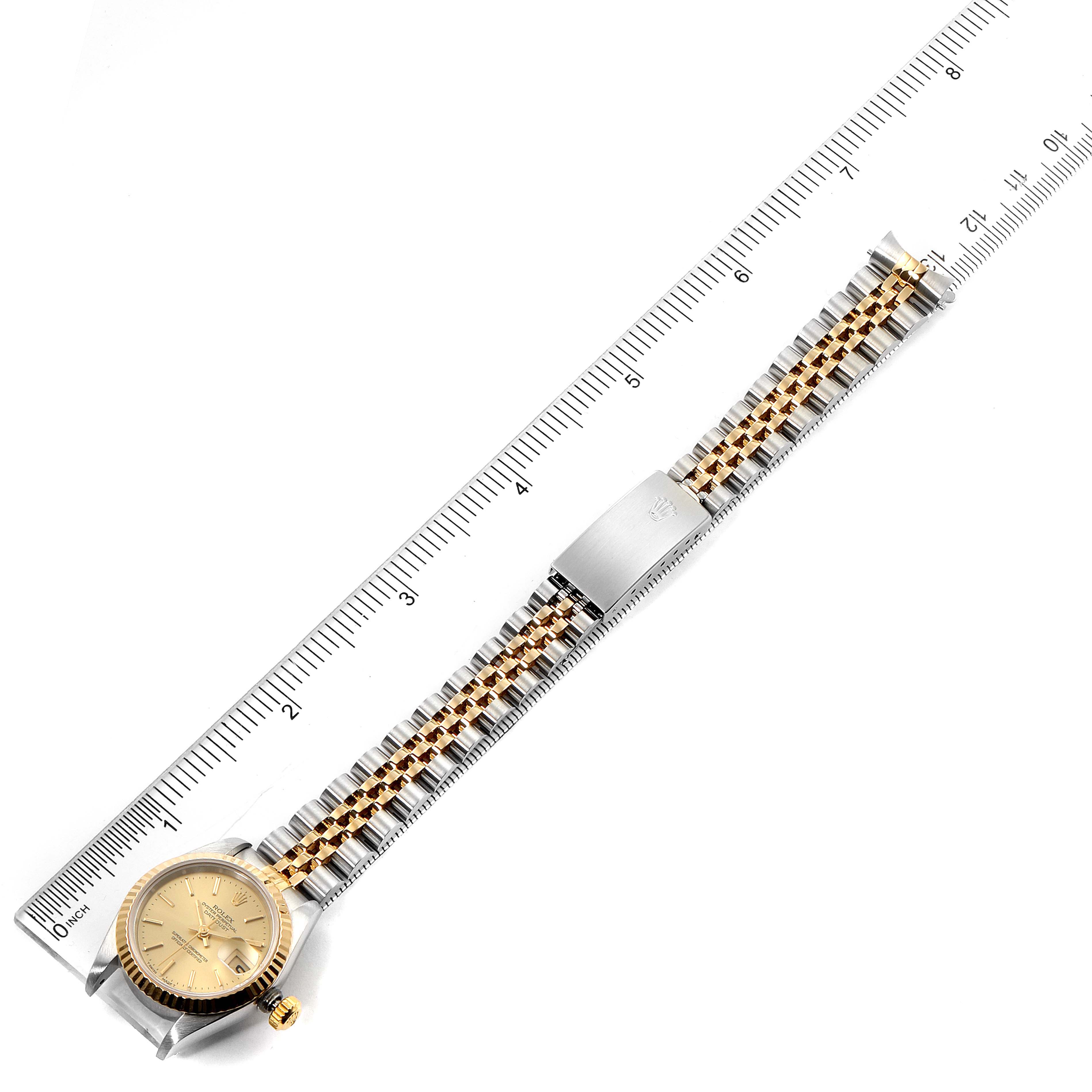 The image shows a top-down view of a Rolex Datejust 69173 Women
s Steel and Gold (two tone) Champagne Dial 69173 Women
s Steel and Gold (two tone) Champagne Dial watch, displaying the watch face, bracelet, and clasp.