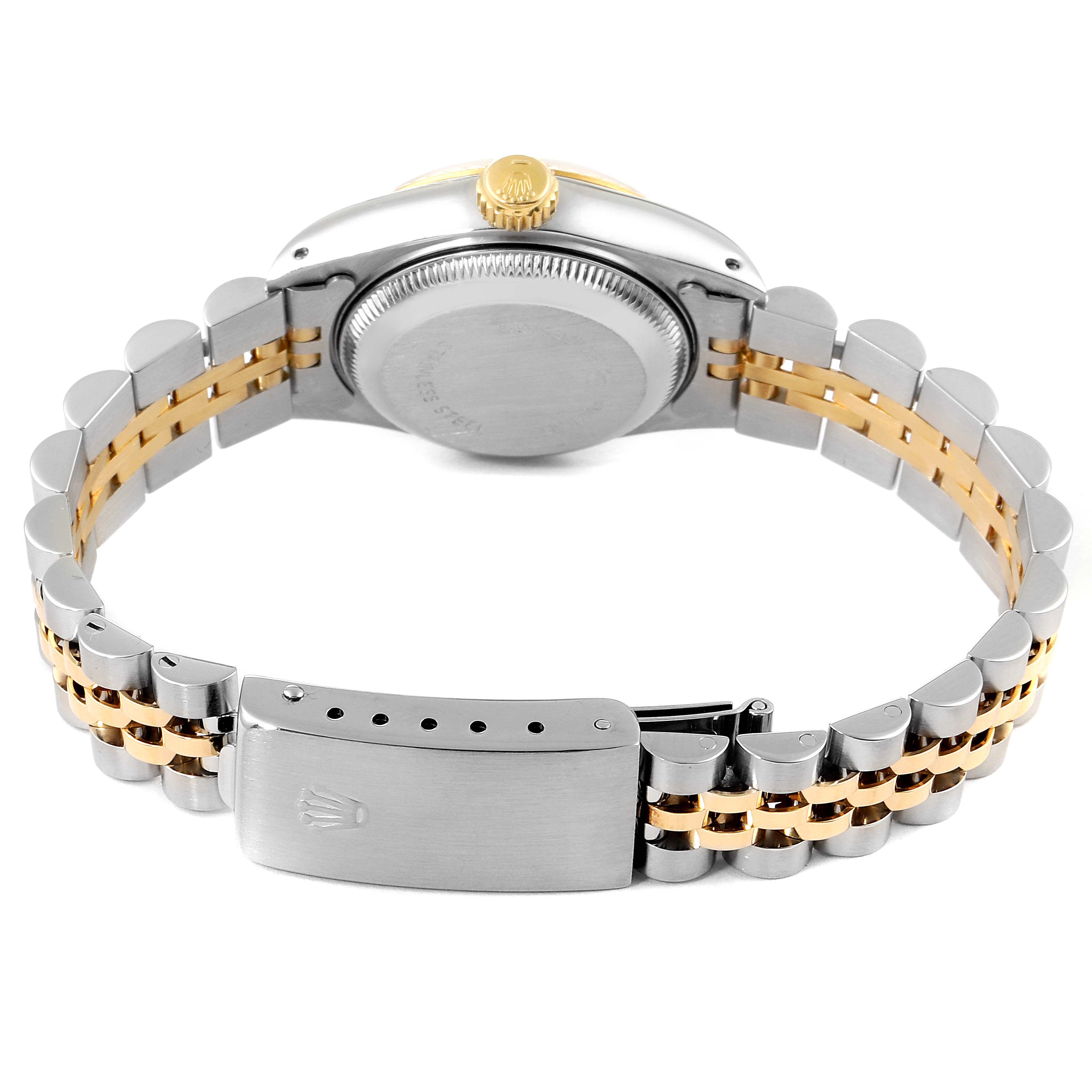 The image shows the back view of a Rolex Datejust 69173 Women
s Steel and Gold (two tone) Champagne Dial 69173 Women
s Steel and Gold (two tone) Champagne Dial watch, highlighting the case back, crown, and two-tone bracelet with a clasp.