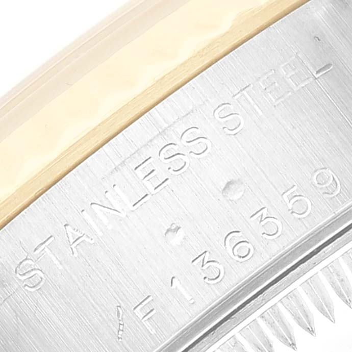 This image shows a close-up of the case back edge highlighting the "Stainless Steel" engraving on a Rolex Datejust 79173 Women's Steel and Gold (two tone) Mother of Pearl Dial 79173 Women's Steel and Gold (two tone) Mother of Pearl Dial watch.
