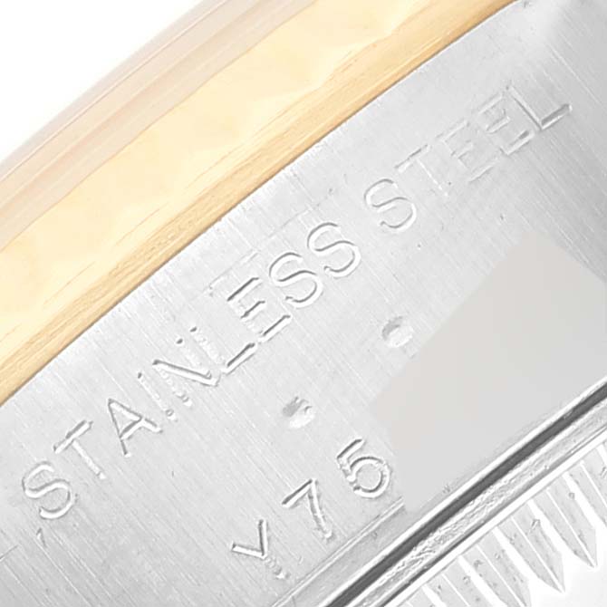 The image shows a close-up of the side casing of a Rolex Datejust 79173NR Women's Steel and Gold (two tone) Mother of Pearl Dial 79173NR Women's Steel and Gold (two tone) Mother of Pearl Dial model, highlighting the "STAINLESS STEEL" engraving.