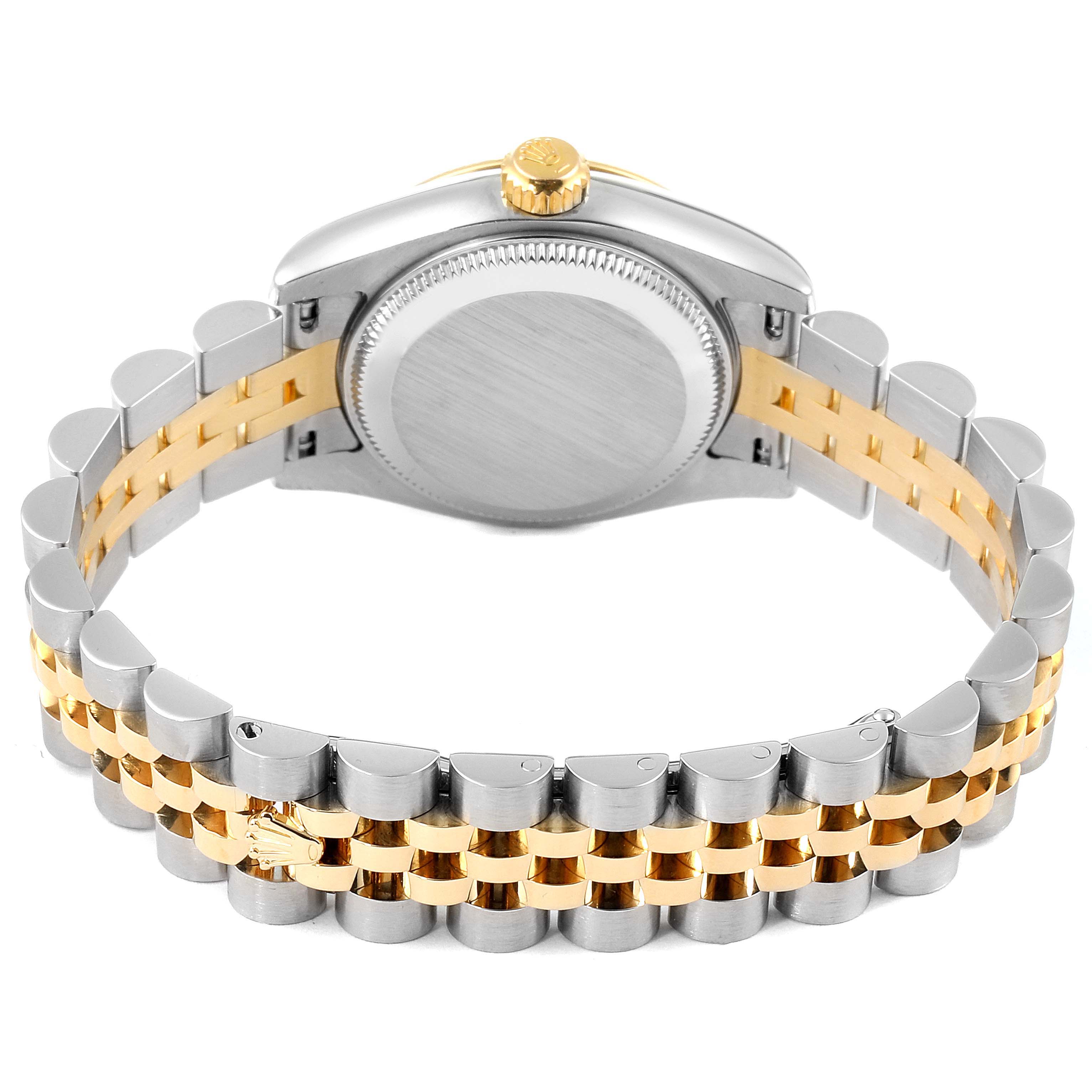 The image shows the back of a Rolex Datejust 179173 Women
s Steel and Gold (two tone) Mother of Pearl Dial 179173 Women
s Steel and Gold (two tone) Mother of Pearl Dial watch, highlighting its case back and two-tone bracelet.