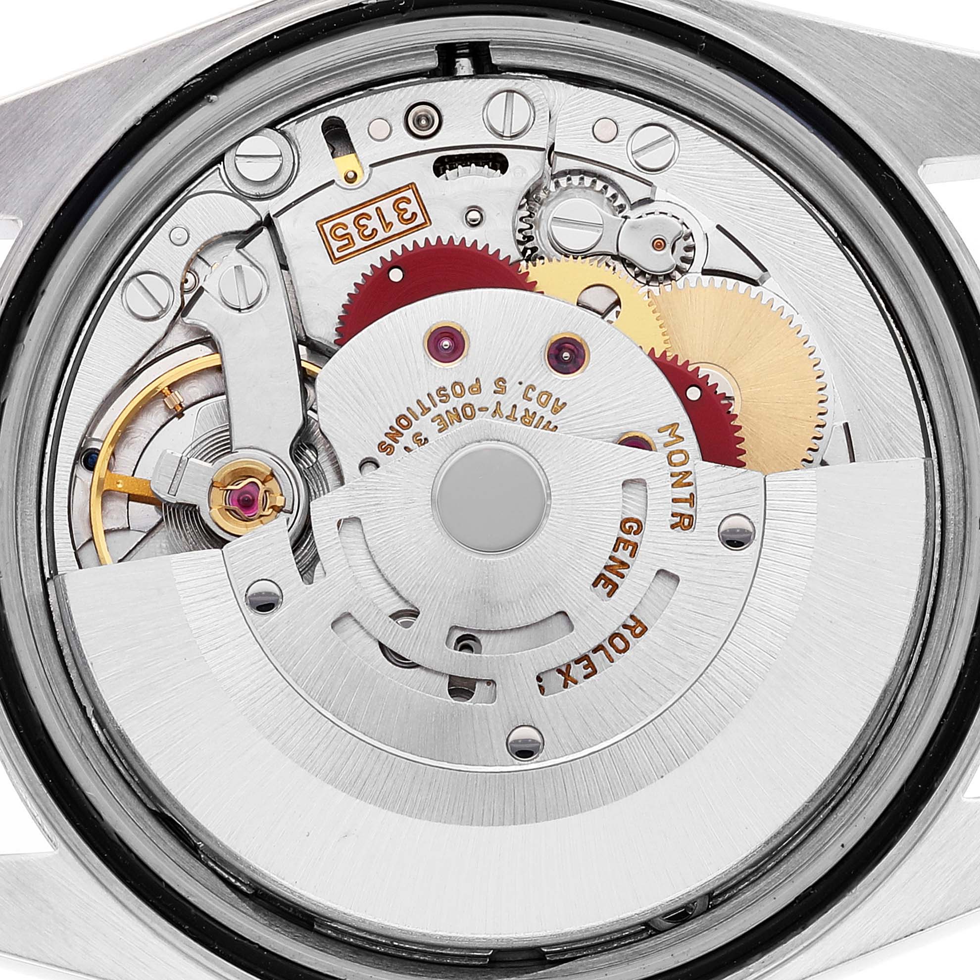 The image shows a detailed view of the internal mechanism of the Rolex Datejust 16233 Men's Steel and Gold (two tone) Silver Dial 16233 Men's Steel and Gold (two tone) Silver Dial watch, focusing on the movement and gears.
