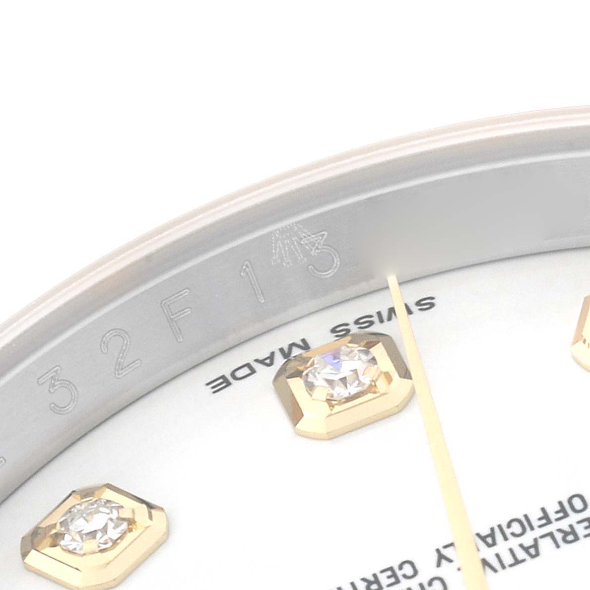 This image shows a close-up of the dial of a Rolex Datejust 116233 Men's Steel and Gold (two tone) White Dial 116233 Men's Steel and Gold (two tone) White Dial watch, including the bezel, diamond markers, and part of the "Swiss Made" inscription.