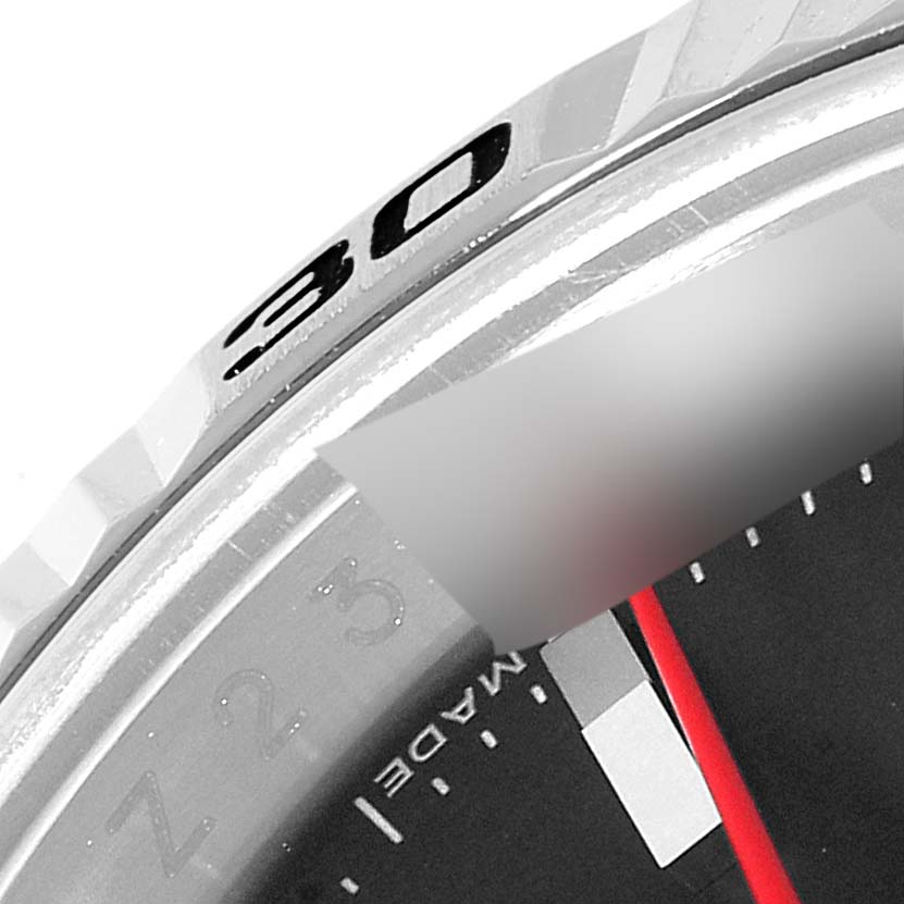 The image shows a close-up of the bezel and part of the dial of a Rolex Turn-o-Graph 116264 Men
s Stainless Steel Black Dial 116264 Men
s Stainless Steel Black Dial watch.