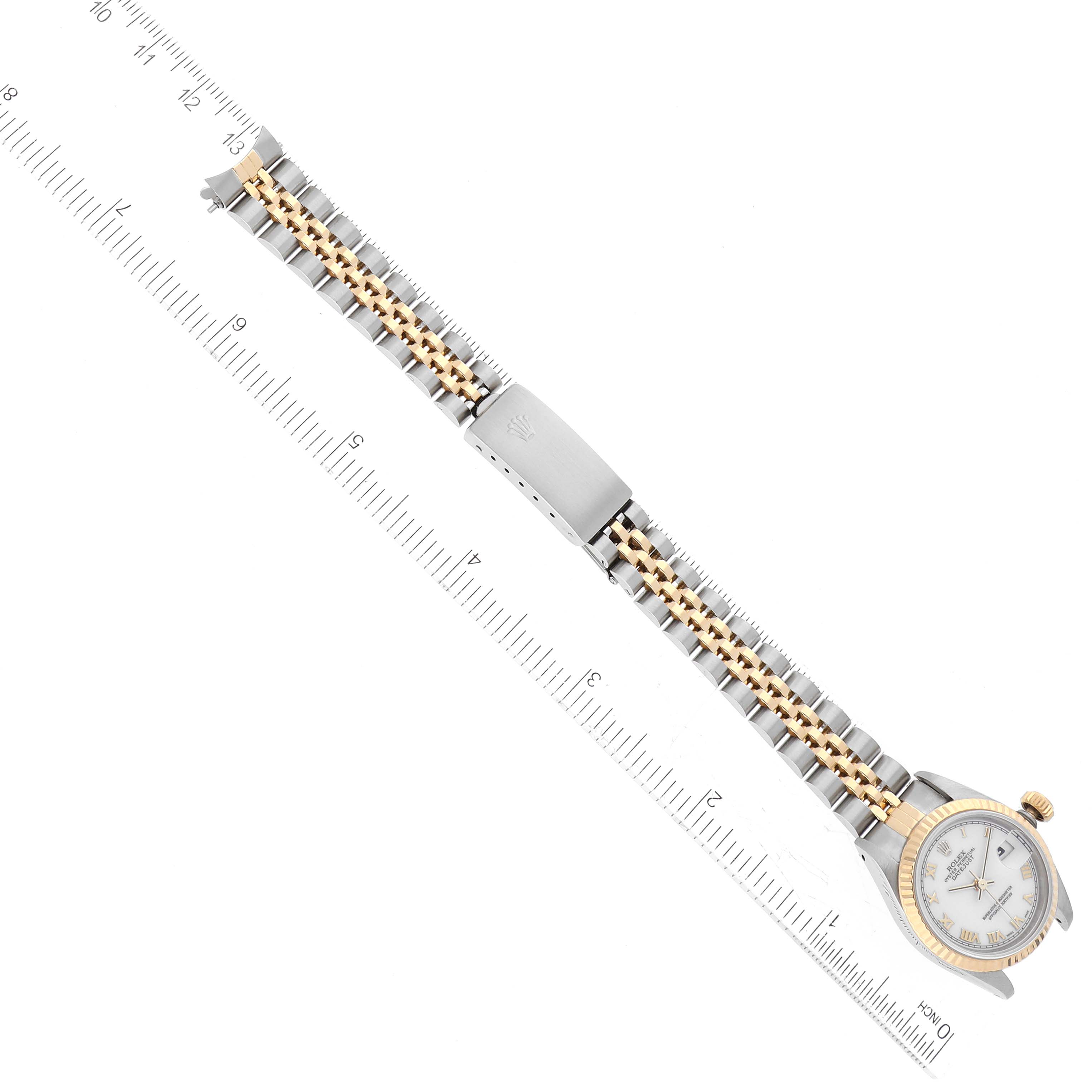The image shows a Rolex Datejust 69173 Women's Steel and Gold (two tone) White Dial 69173 Women's Steel and Gold (two tone) White Dial watch from an overhead angle, displaying the bracelet and dial, with a ruler for scale.