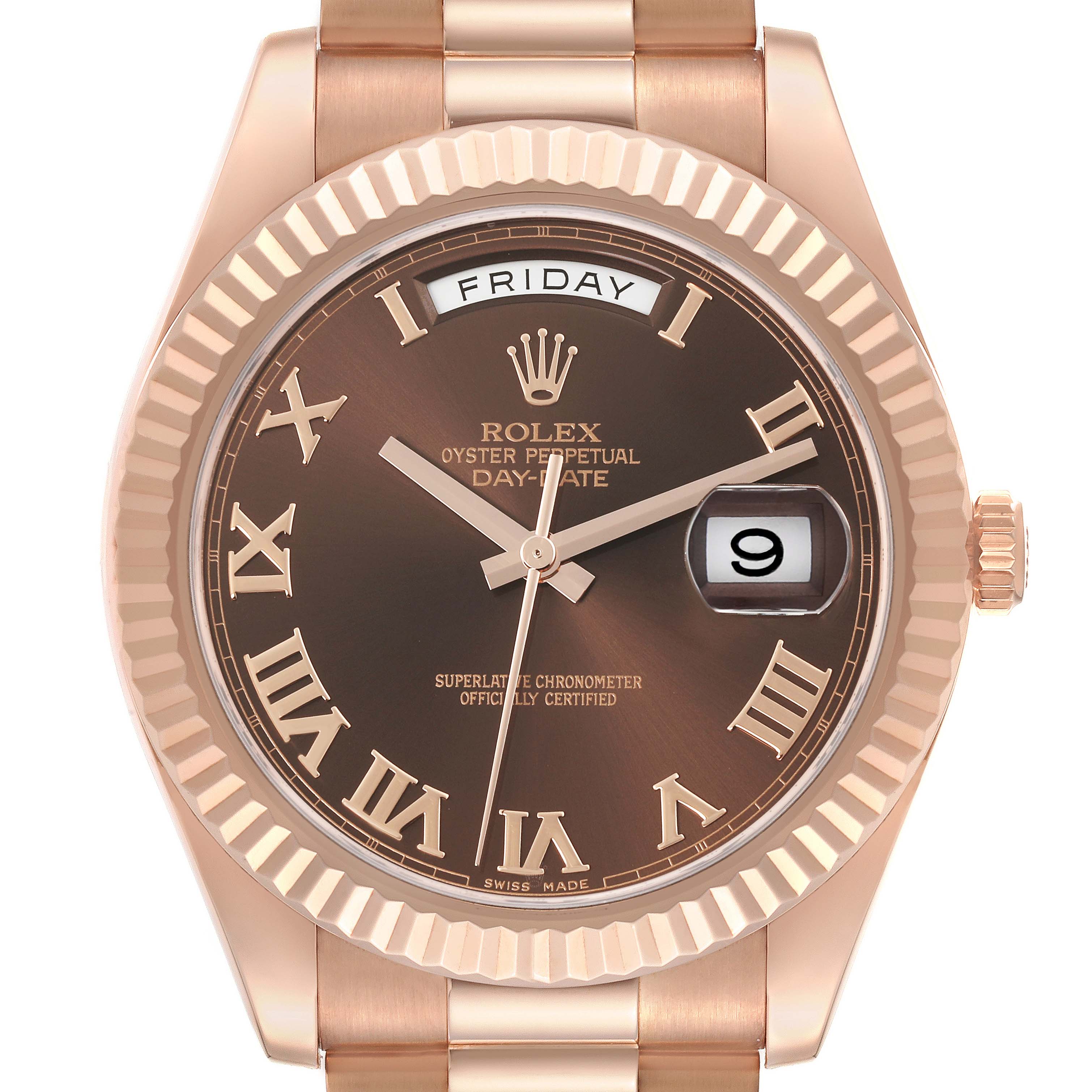The Rolex President 218235 Men's Rose Gold Brown Dial 218235 Men's Rose Gold Brown Dial model is shown from the front, displaying its dial, hands, day-date feature, and fluted bezel.