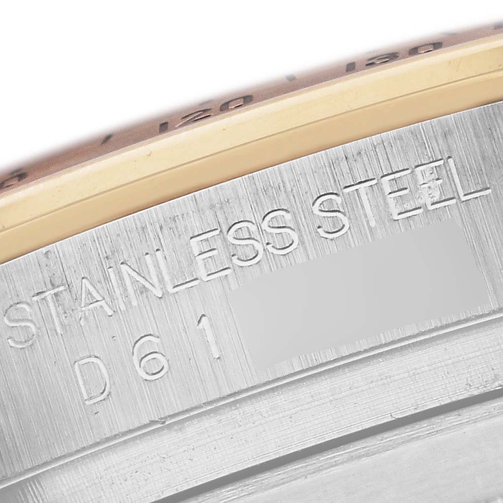 The image shows a close-up of the Rolex Daytona 116523NR Men's Steel and Gold (two tone) Mother of Pearl Dial 116523NR Men's Steel and Gold (two tone) Mother of Pearl Dial's side case, highlighting "Stainless Steel" engraving.