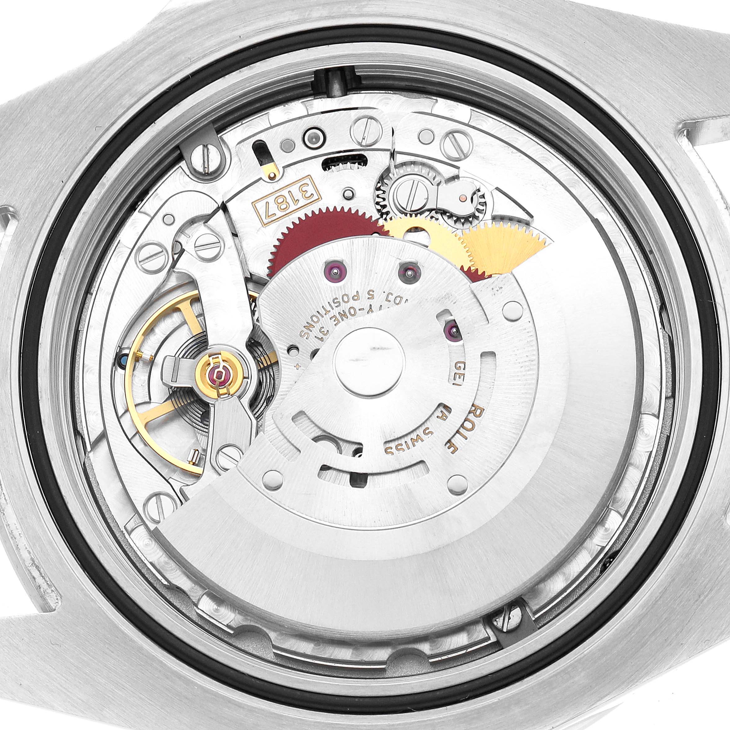 The image shows the movement of the Rolex Explorer 216570 Men's Stainless Steel White Dial model from a top-down angle, highlighting its intricate mechanical parts.
