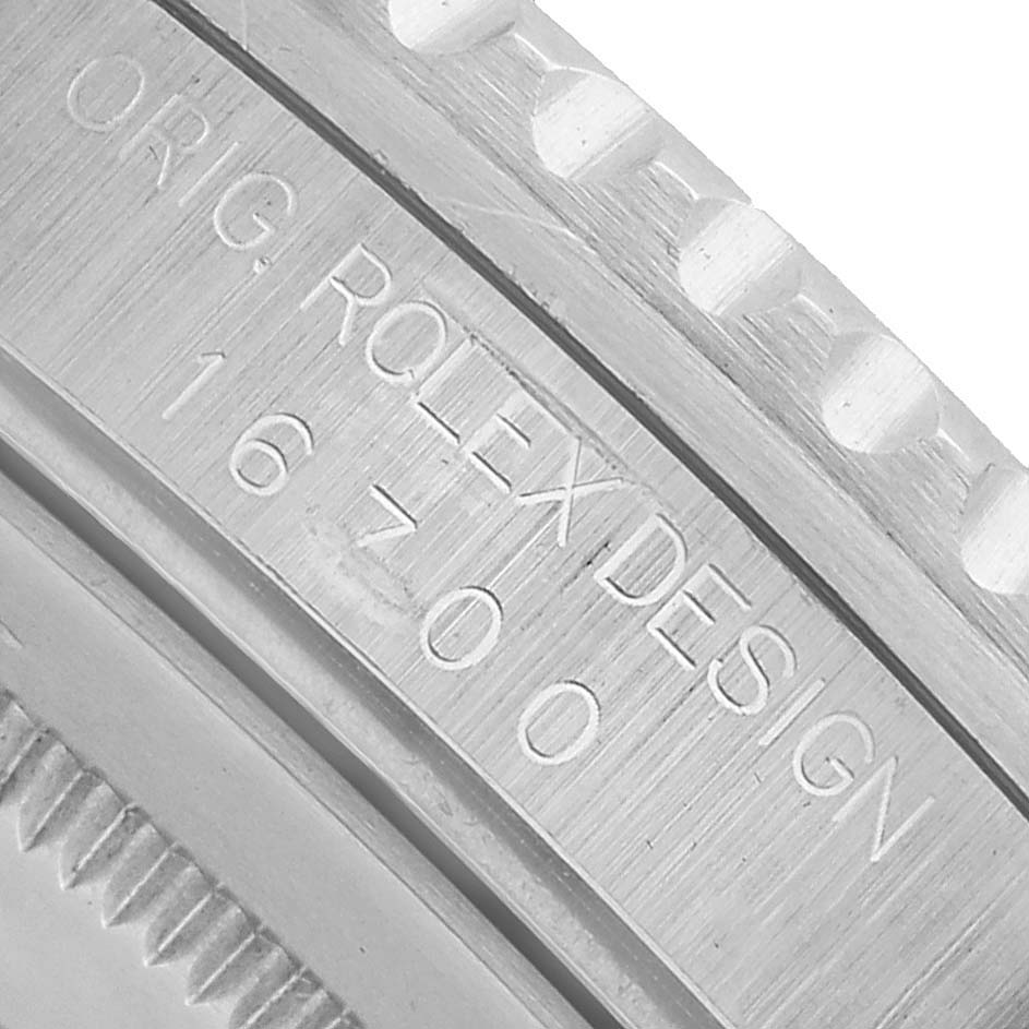The image shows a close-up of the side engraving on a Rolex Yacht-Master 16700 Men's Stainless Steel Black Dial, with design numbers visible.