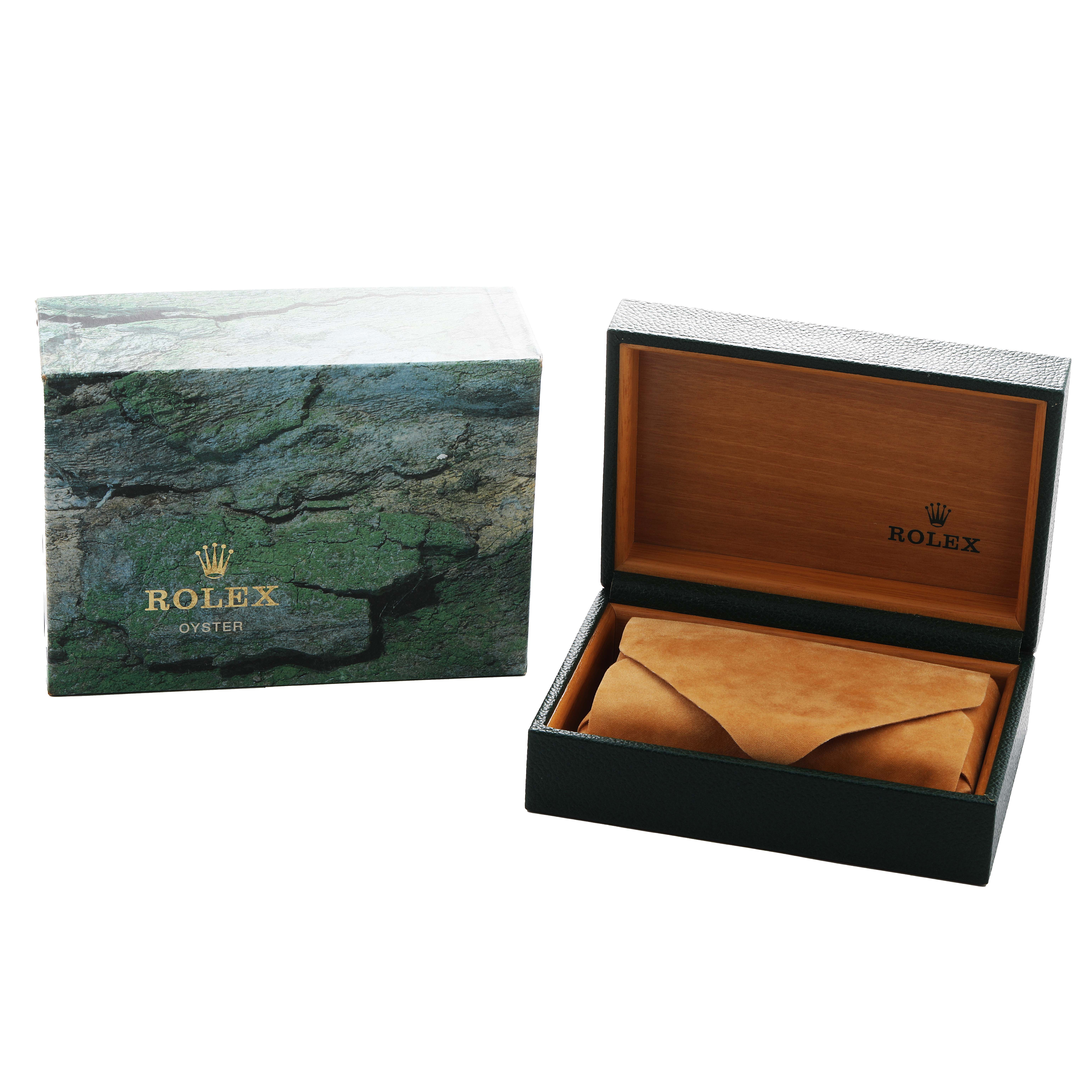 The image shows the Rolex Yacht-Master 16700 Men's Stainless Steel Black Dial's packaging: an open leather watch box, and a textured outer box.