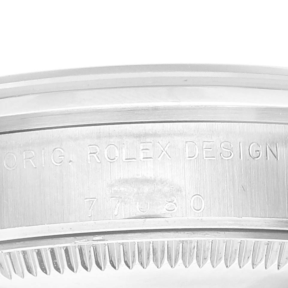 This is a close-up shot of the case side of a Mid-Size Rolex watch, showing "ORIG. ROLEX DESIGN" and the model number 77080.