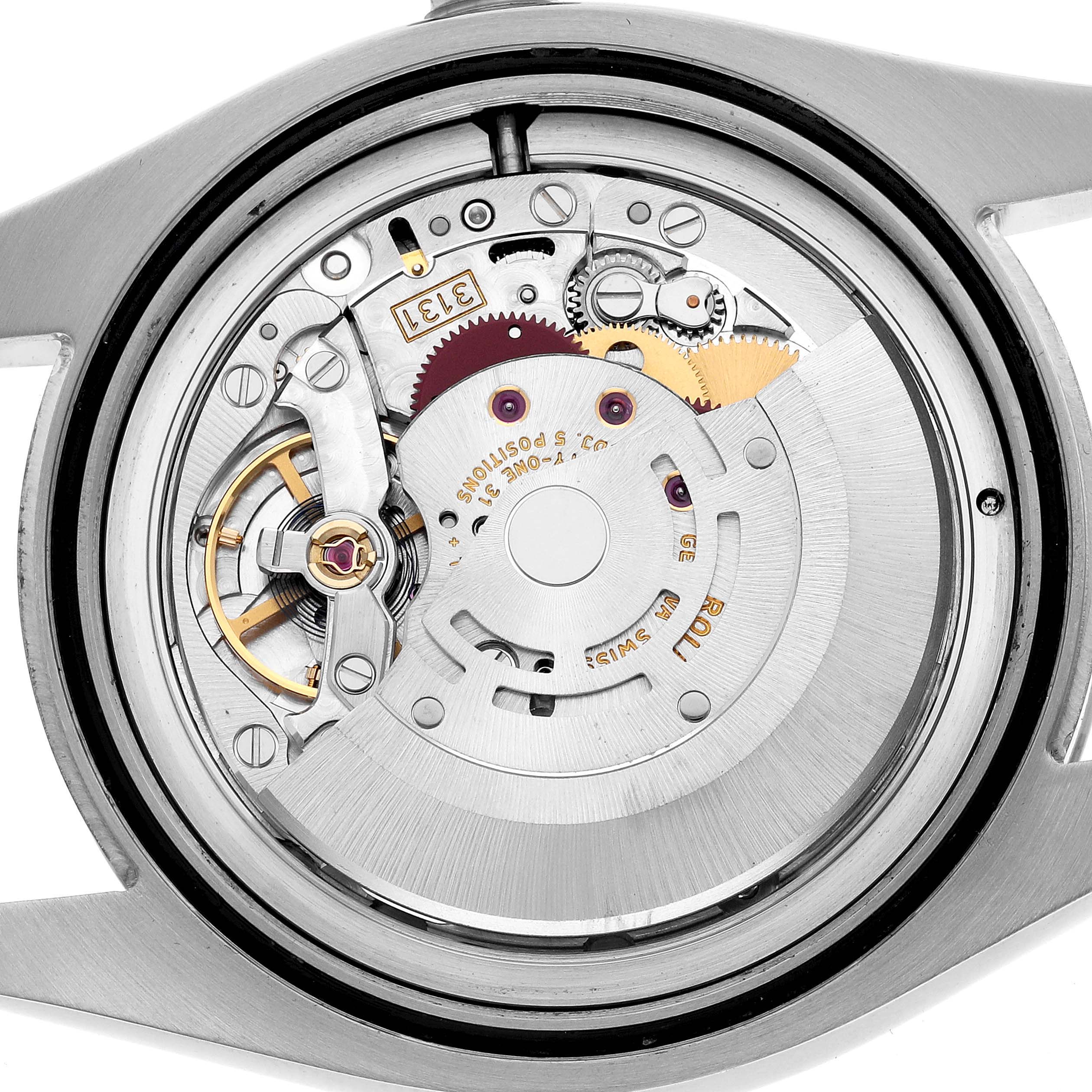 This image shows the internal mechanics of a Rolex Milgauss 116400 Men's Stainless Steel White Dial watch viewed from the back, highlighting its movement components.