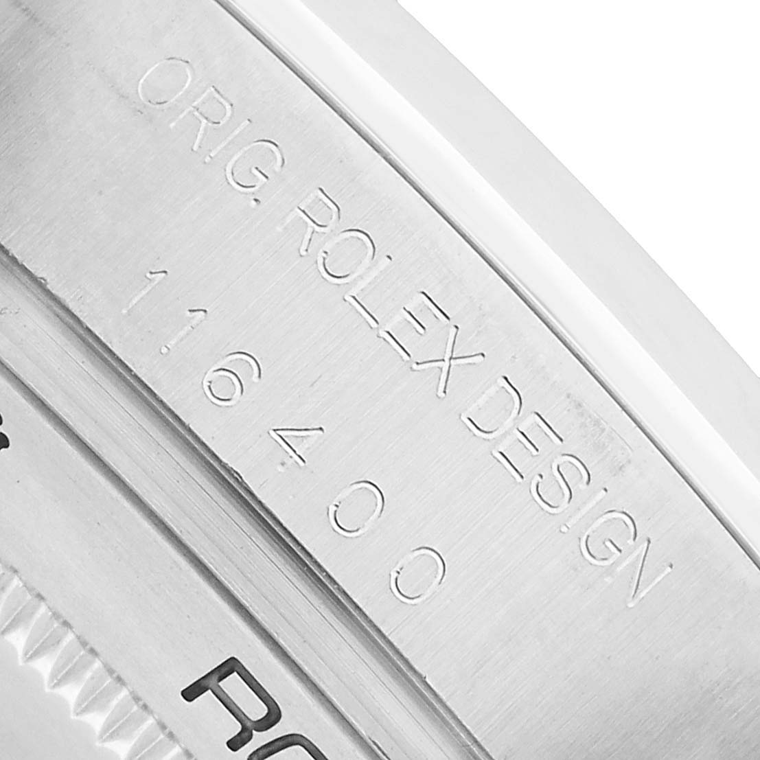 The image shows the side view of a Milgauss model by Rolex, focusing on the engraved model number and design details on the case.