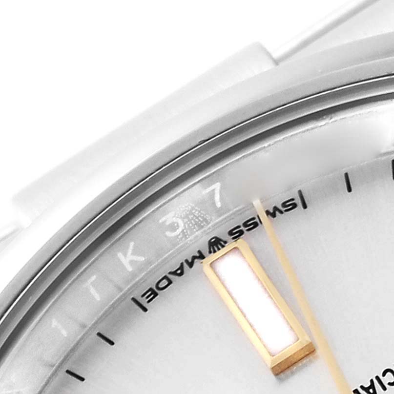 The image shows a close-up of the dial and part of the bezel of a Rolex Oyster Perpetual 124200 Men's Stainless Steel Silver Dial 124200 Men's Stainless Steel Silver Dial watch.