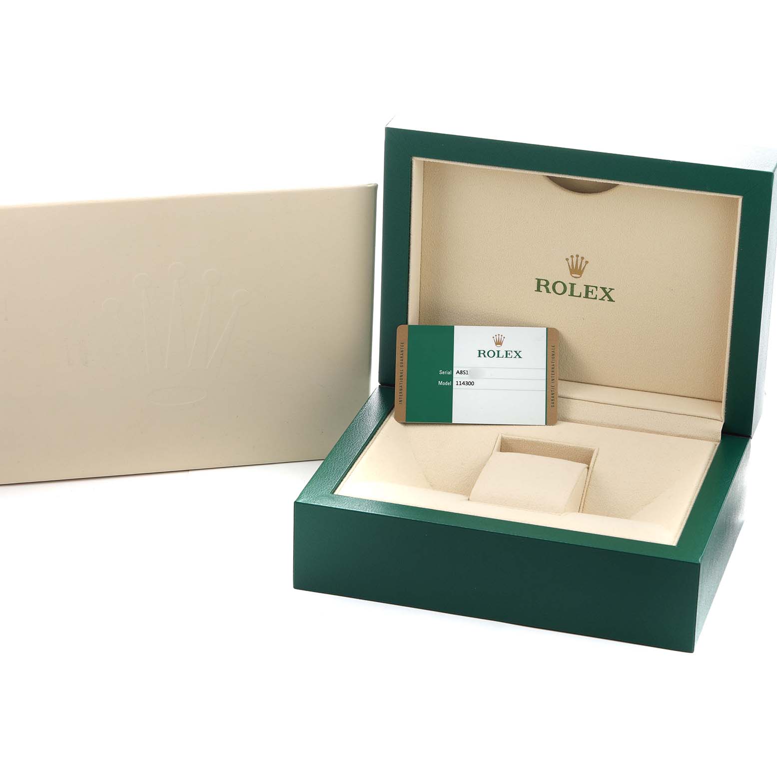 The image shows the open box and warranty card for a Rolex Oyster Perpetual 114300 Men's Stainless Steel Silver Dial watch, viewed from the front.