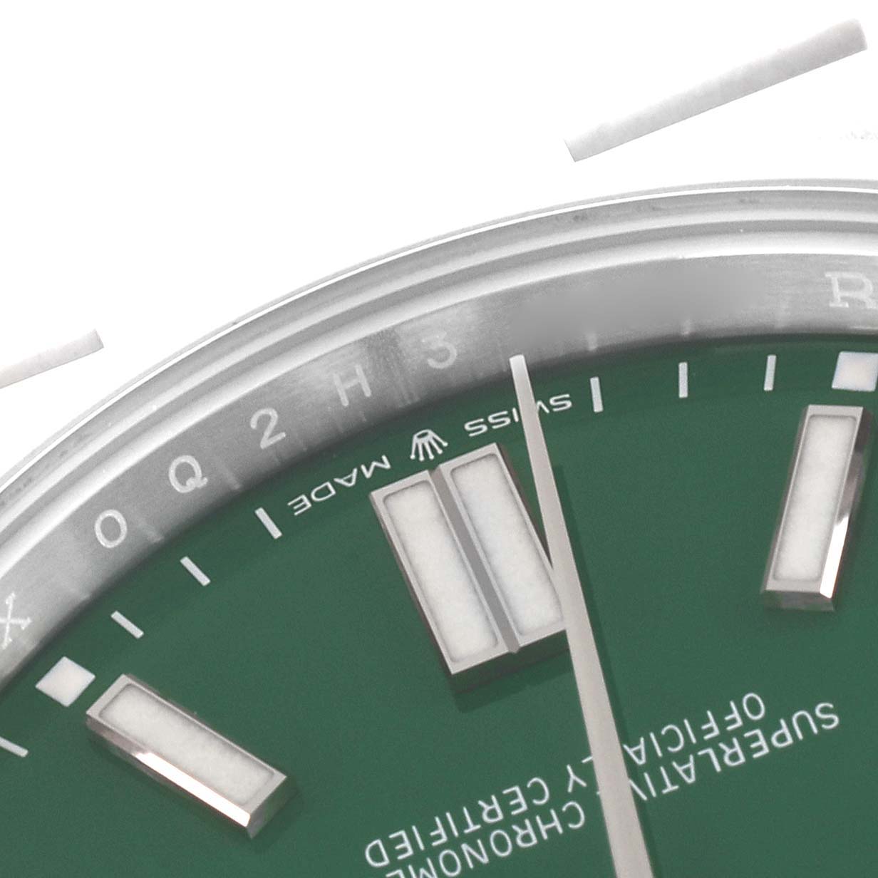 The image shows a close-up of the dial and hour markers of a Rolex Oyster Perpetual 124300 Men's Stainless Steel Green Dial 124300 Men's Stainless Steel Green Dial watch.