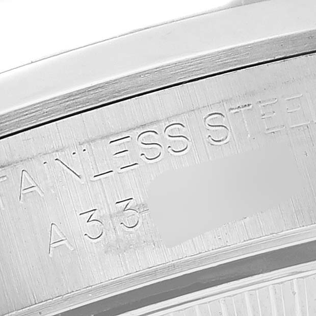 The close-up image shows the engraved text on the stainless steel case back of a Rolex Oyster Perpetual 76080 Women's Stainless Steel Black Dial 76080 Women's Stainless Steel Black Dial watch.