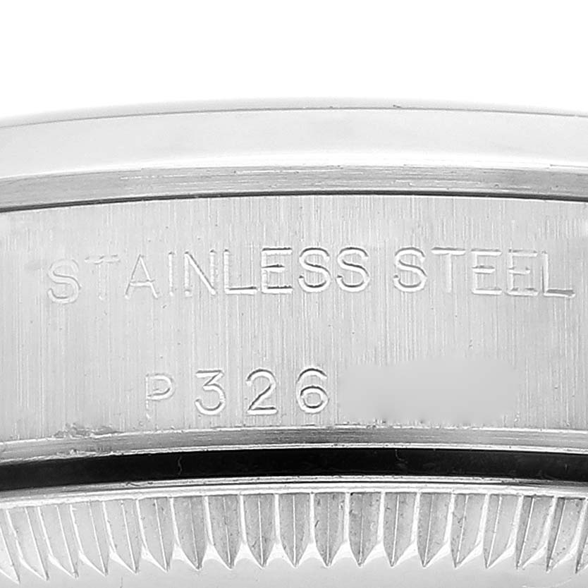 This close-up image shows the side engraving on a stainless steel Rolex Oyster Perpetual 76080 Women
s Stainless Steel Blue Dial 76080 Women
s Stainless Steel Blue Dial watch case.