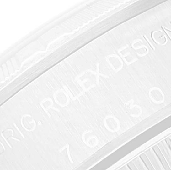 The image shows a close-up of the engraved caseback edge on a Rolex Oyster Perpetual 76030 Women
s Stainless Steel Pink Dial 76030 Women
s Stainless Steel Pink Dial watch.