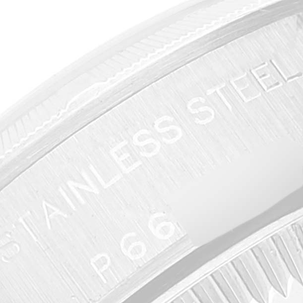 The image shows a close-up of the side edge of the bezel on a Rolex Oyster Perpetual 76030 Women
s Stainless Steel Pink Dial 76030 Women
s Stainless Steel Pink Dial watch, highlighting the "Stainless Steel" engraving.