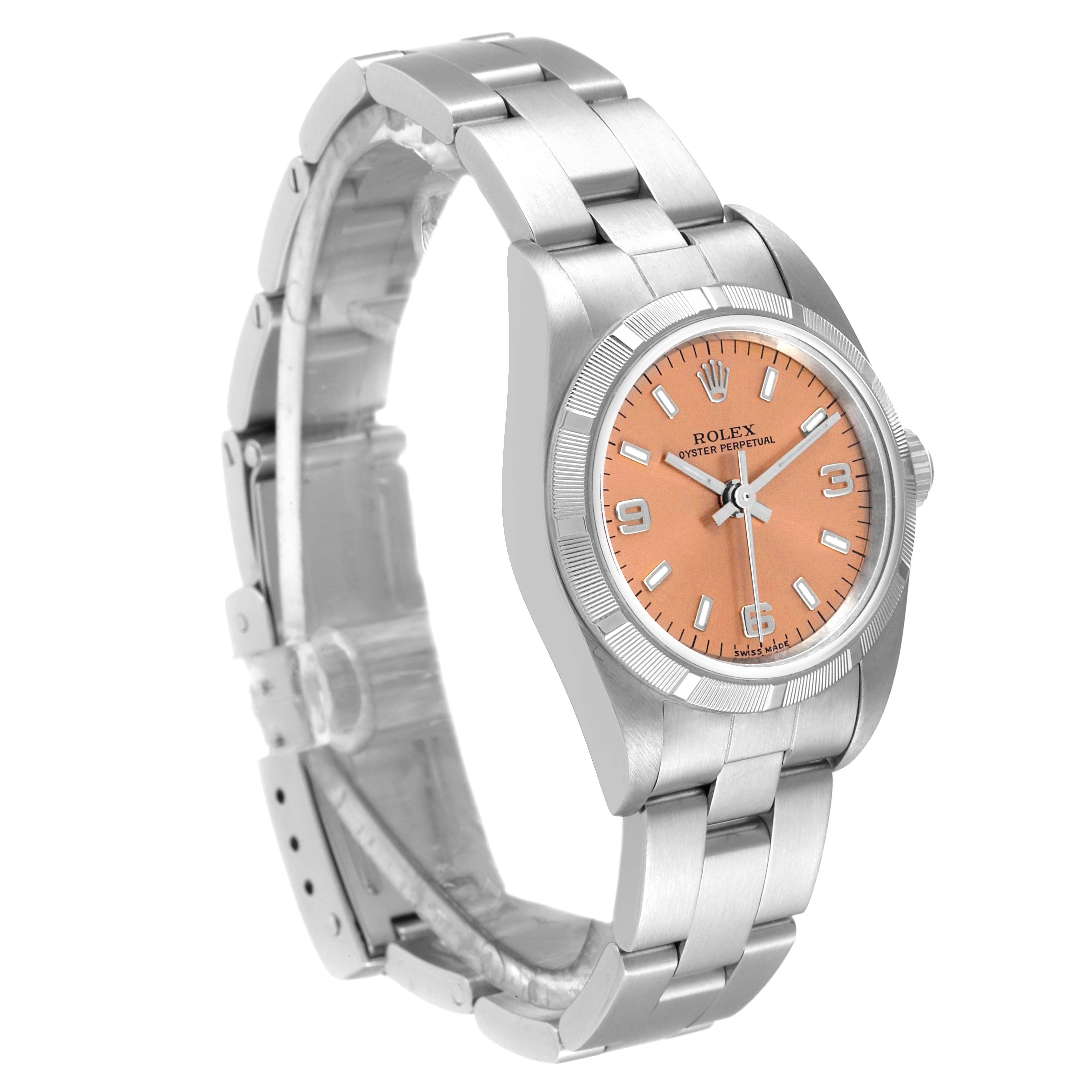 This Rolex Oyster Perpetual 76030 Women
s Stainless Steel Pink Dial 76030 Women
s Stainless Steel Pink Dial watch is shown from a front-left angle, displaying its bracelet, case, and peach dial.