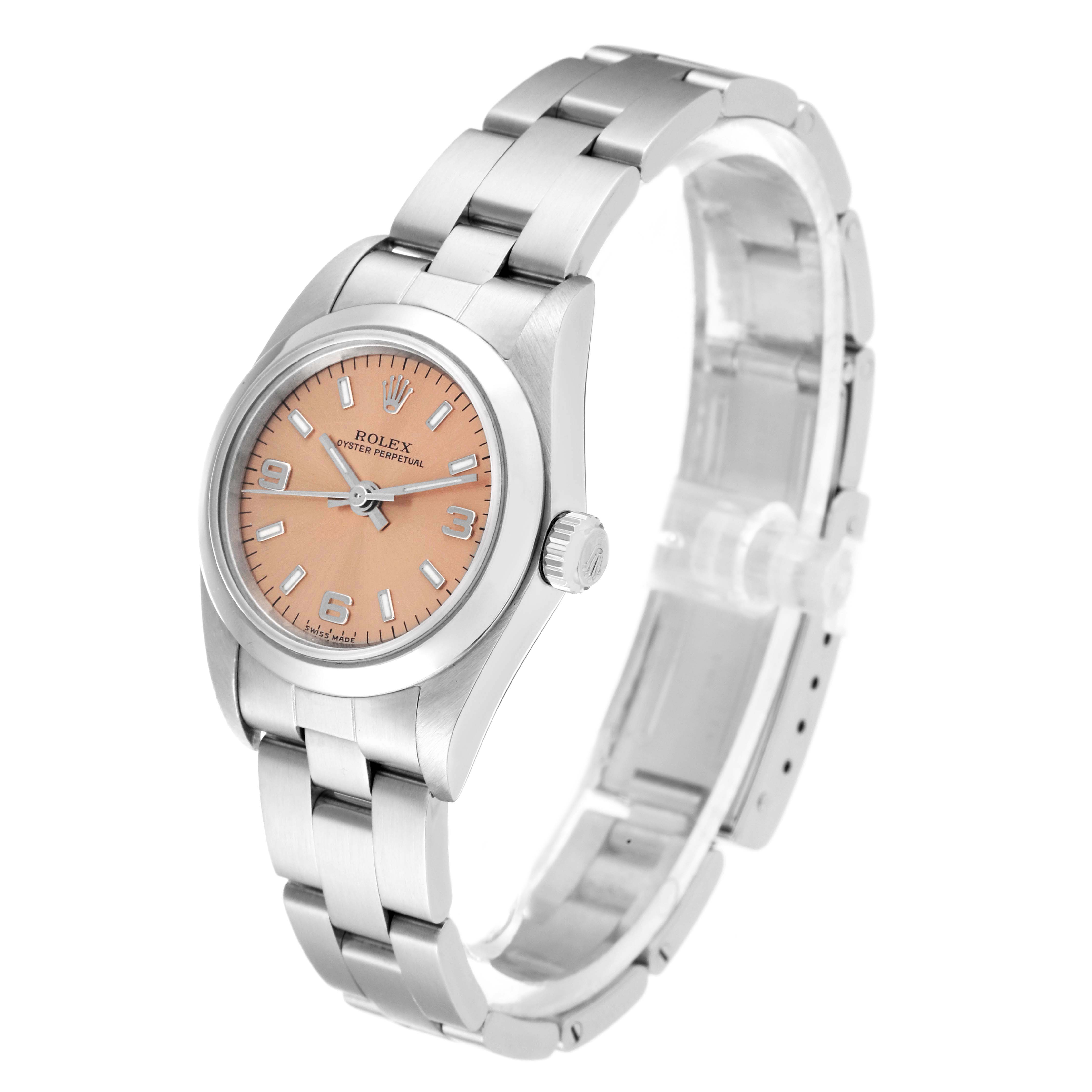 The Rolex Oyster Perpetual 76080 Women's Stainless Steel Orange Dial 76080 Women's Stainless Steel Orange Dial watch is shown from a front angle, displaying its dial, bezel, crown, and metal bracelet.