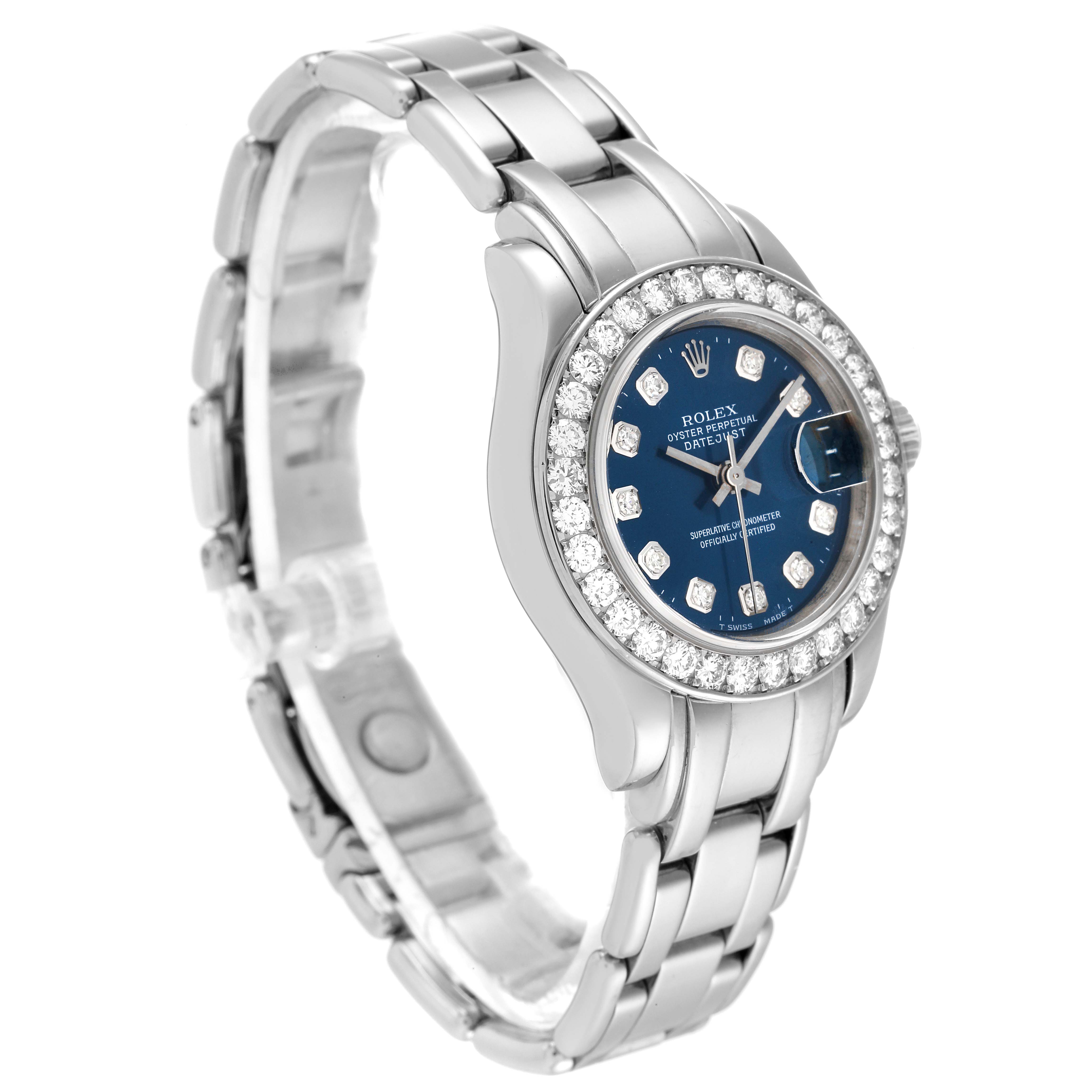 The Rolex Pearlmaster 69299 Women
s White Gold Blue Dial 69299 Women
s White Gold Blue Dial watch is shown from a front-side angle, highlighting its dial, bezel, and bracelet.