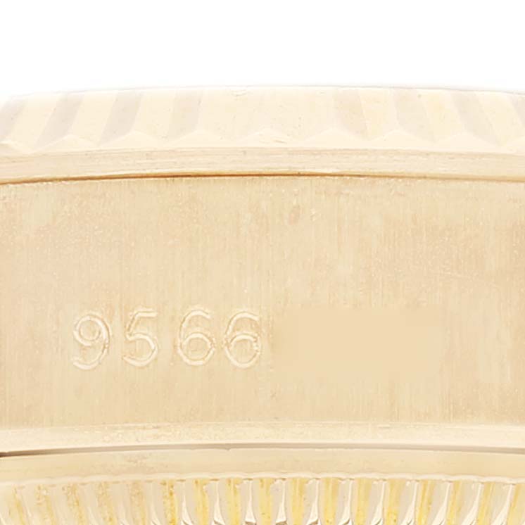 The image shows a close-up of the side of the Rolex President 69178 Women
s Yellow Gold Champagne Dial 69178 Women
s Yellow Gold Champagne Dial model, displaying the serial number engraving.