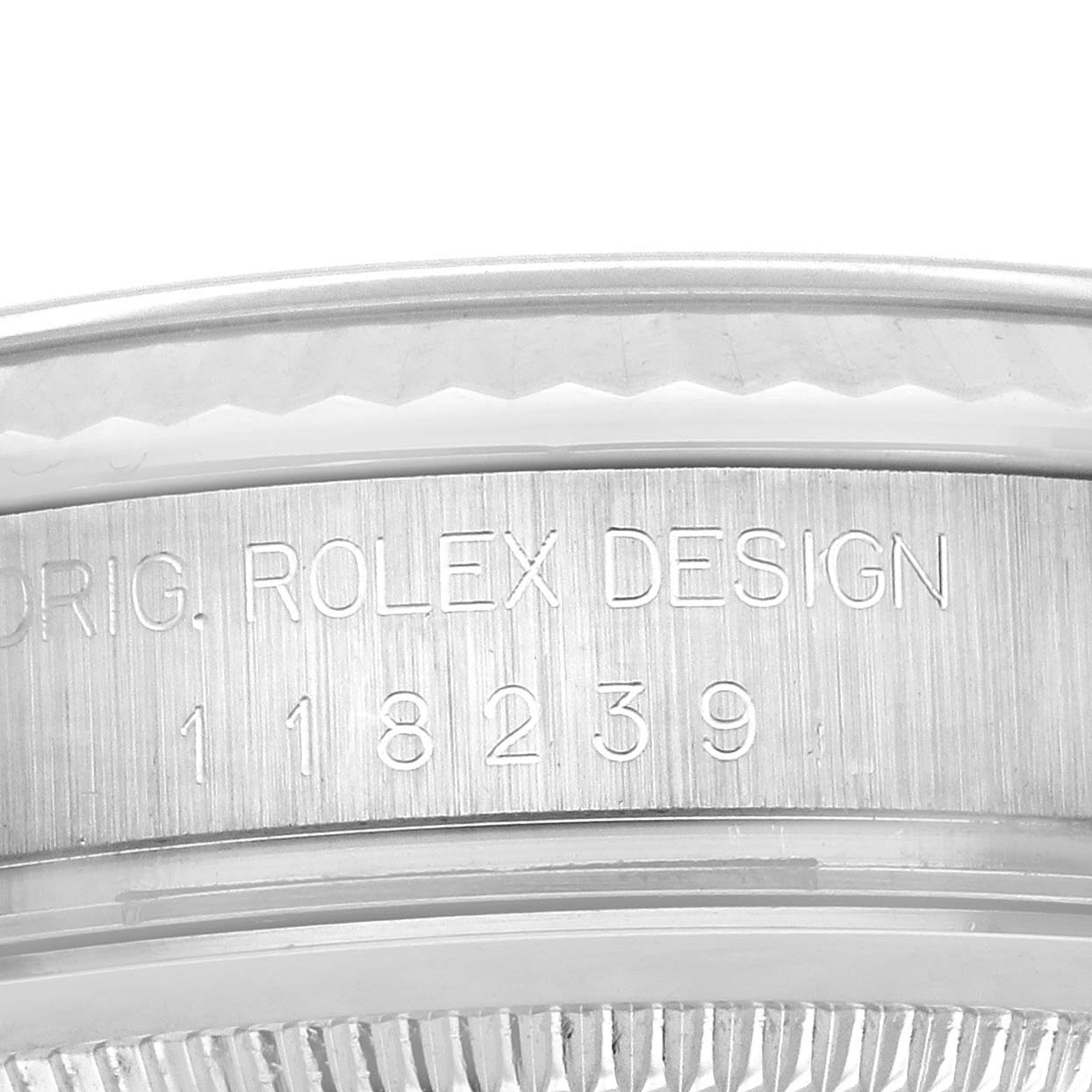 The image shows a close-up of the side of the Rolex President 118239 Men's White Gold Blue Dial 118239 Men's White Gold Blue Dial model case, highlighting the "Orig. Rolex Design" engraving and model number.