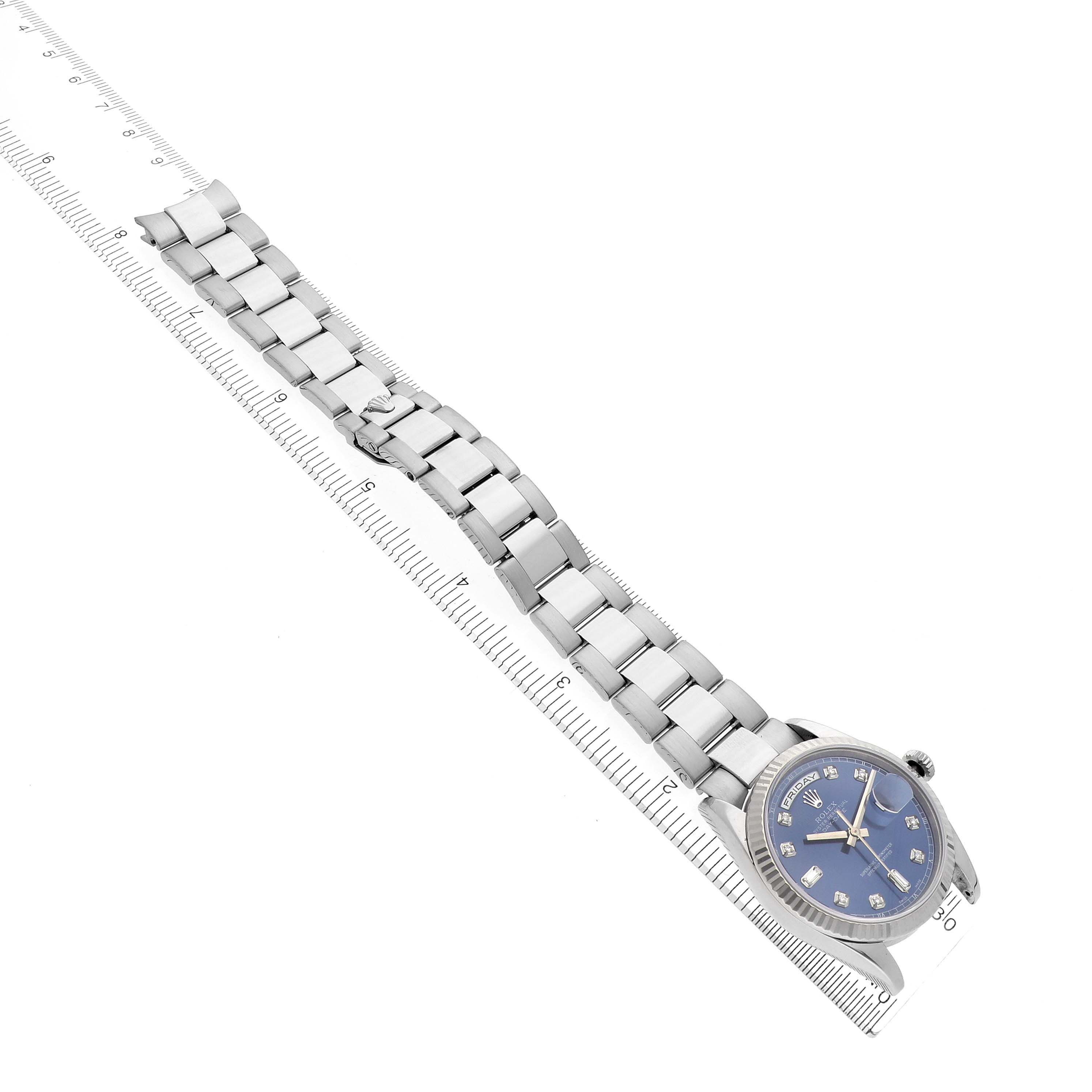 The image shows the Rolex President 118239 Men's White Gold Blue Dial 118239 Men's White Gold Blue Dial model at an oblique angle, highlighting the bracelet, dial, and casing beside a ruler.