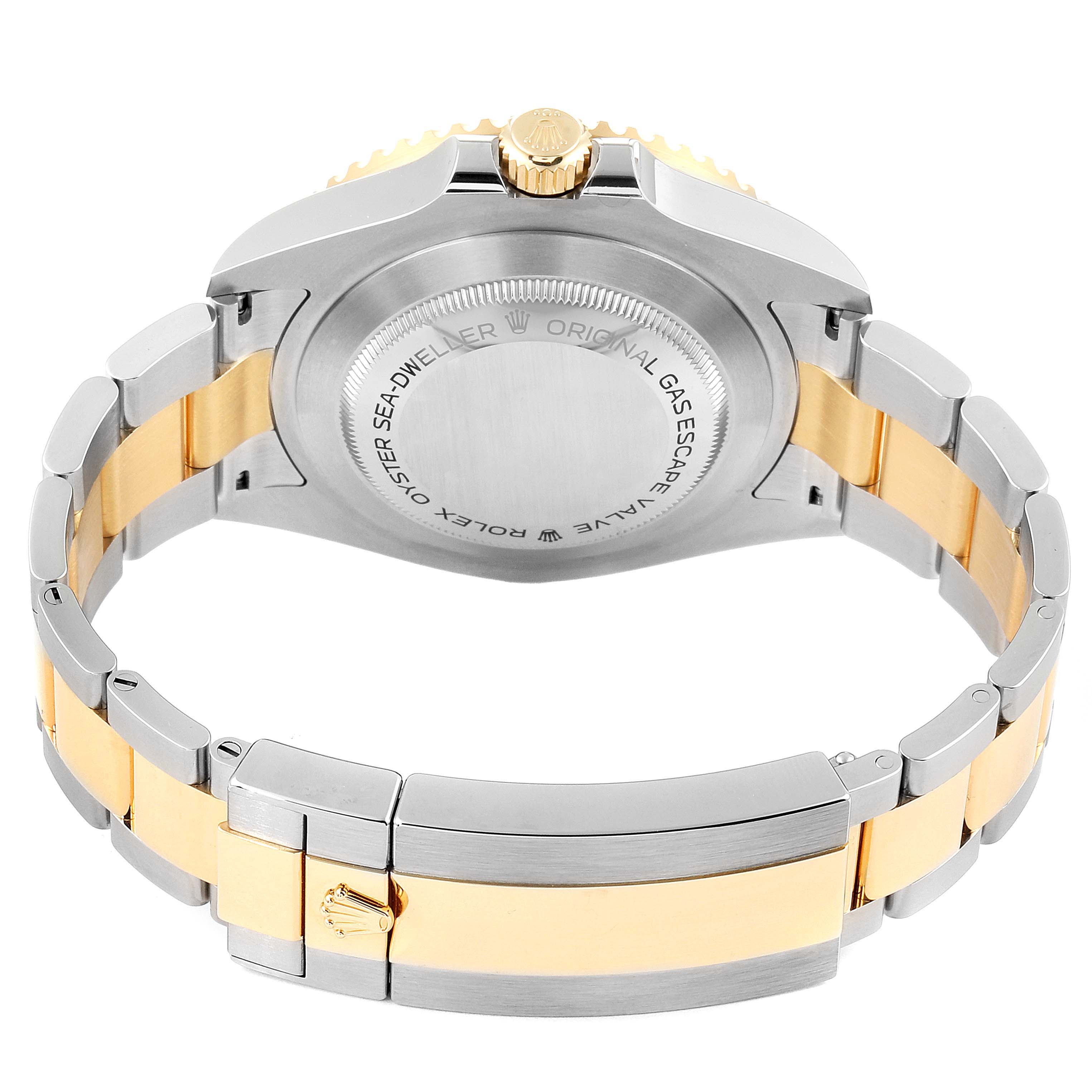 The image shows the back case and bracelet of a Rolex Sea-Dweller 126603 Men
s Steel and Gold (two tone) Black Dial 126603 Men
s Steel and Gold (two tone) Black Dial watch, featuring a two-tone metal design.