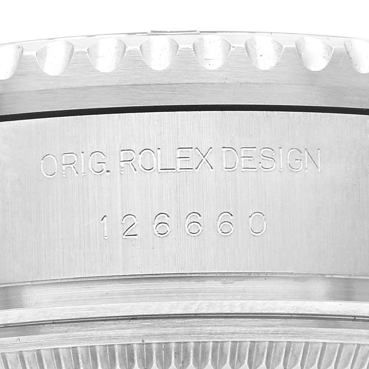 The image shows a close-up of the case side of the Rolex Sea-Dweller 126660 Men's Stainless Steel Blue Dial 126660 Men's Stainless Steel Blue Dial with engraved model number 126660.