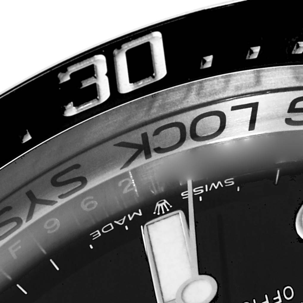 The close-up image of the Rolex Sea-Dweller 126660 Men's Stainless Steel Blue Dial 126660 Men's Stainless Steel Blue Dial shows part of the bezel with the "30" minute marker and part of the dial with the "Swiss Made" label.