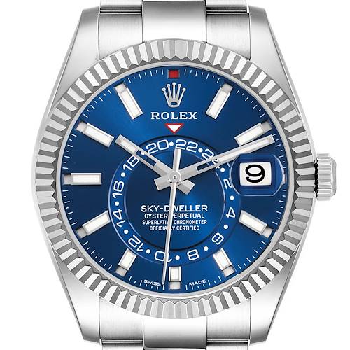 The Rolex Sky-Dweller watch is shown from the front, highlighting its blue dial, bezel, and bracelet.