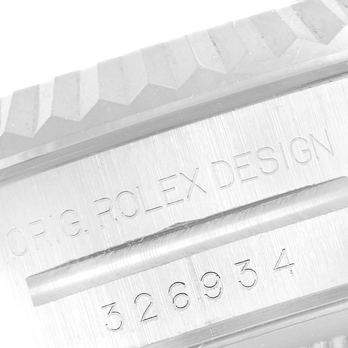 This image shows a close-up of the serial number and "ORIG. ROLEX DESIGN" engraving on the case of a Rolex Sky-Dweller 326934 Men's Stainless Steel White Dial 326934 Men's Stainless Steel White Dial watch.