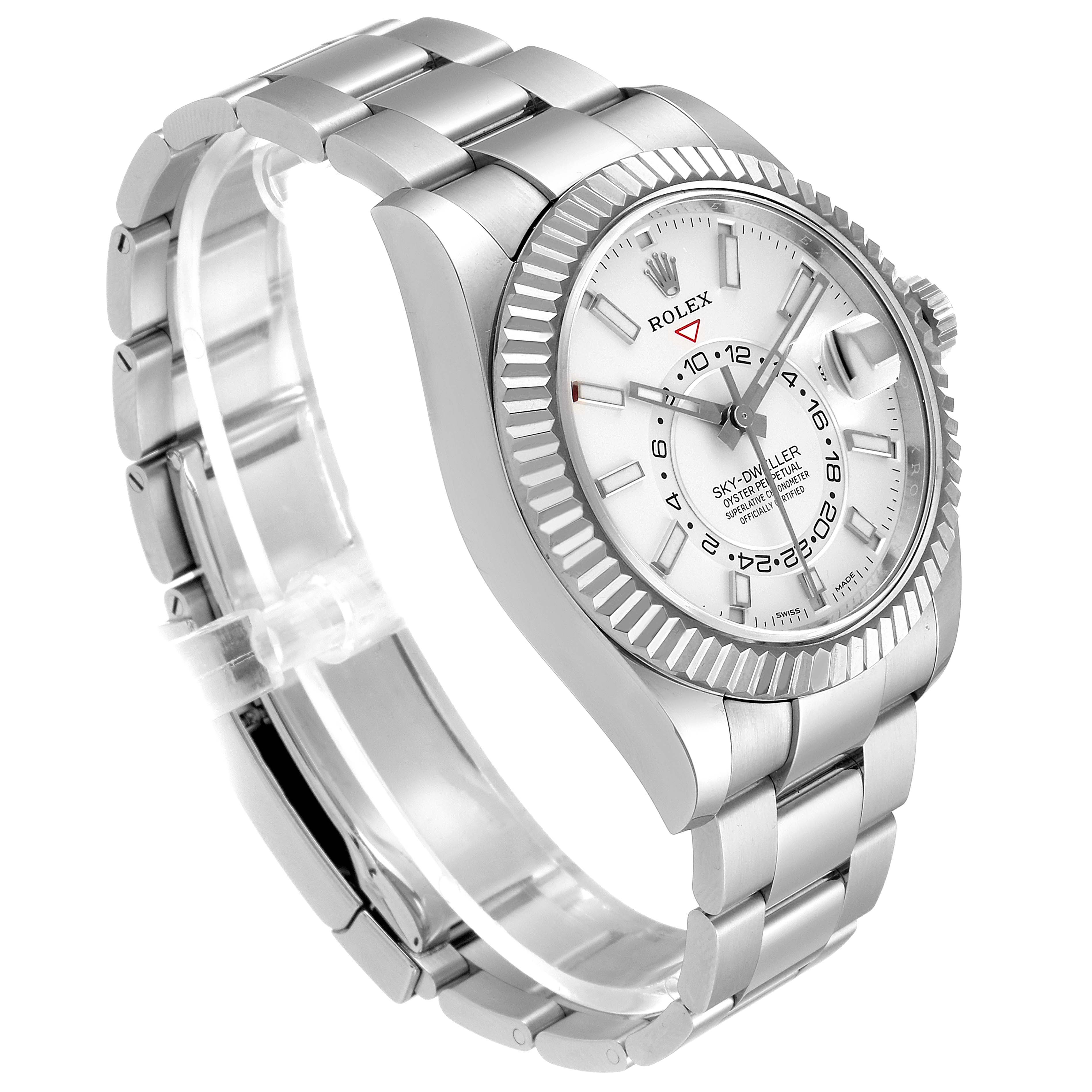 The Rolex Sky-Dweller 326934 Men's Stainless Steel White Dial 326934 Men's Stainless Steel White Dial watch is shown at a three-quarter angle, highlighting its face, bezel, and bracelet.