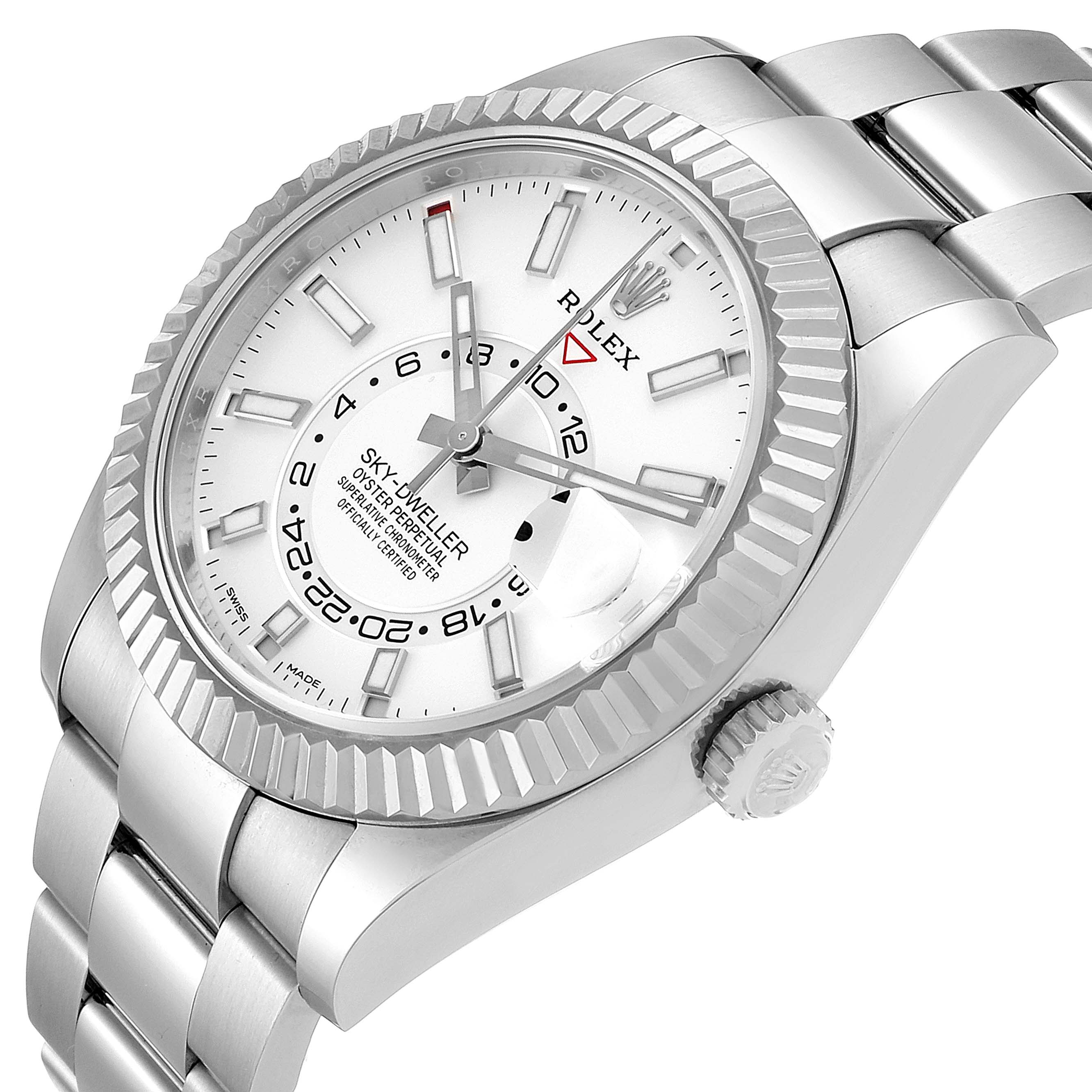 The image shows a Rolex Sky-Dweller 326934 Men's Stainless Steel White Dial 326934 Men's Stainless Steel White Dial watch from a front-side angle highlighting the dial, bezel, crown, and part of the bracelet.