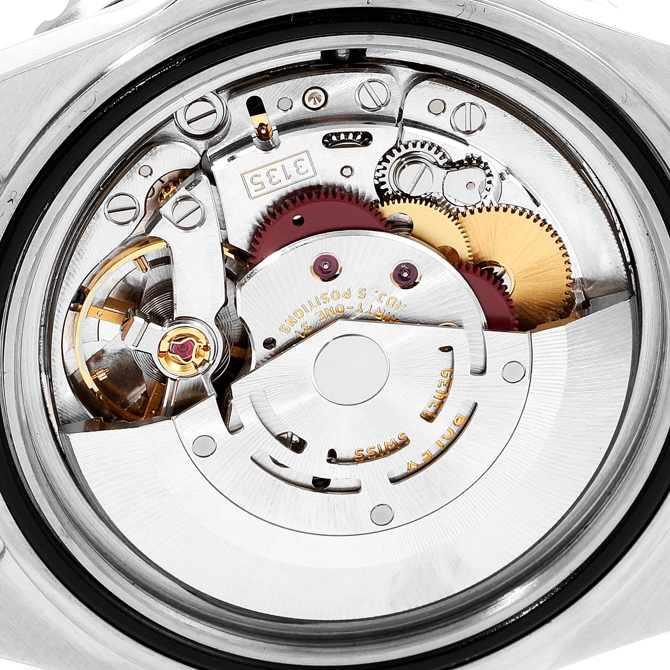 The image shows the internal movement mechanism of a Rolex Submariner 16610 Men's Stainless Steel Black Dial 16610 Men's Stainless Steel Black Dial watch from a rear angle, highlighting gears and rotors.