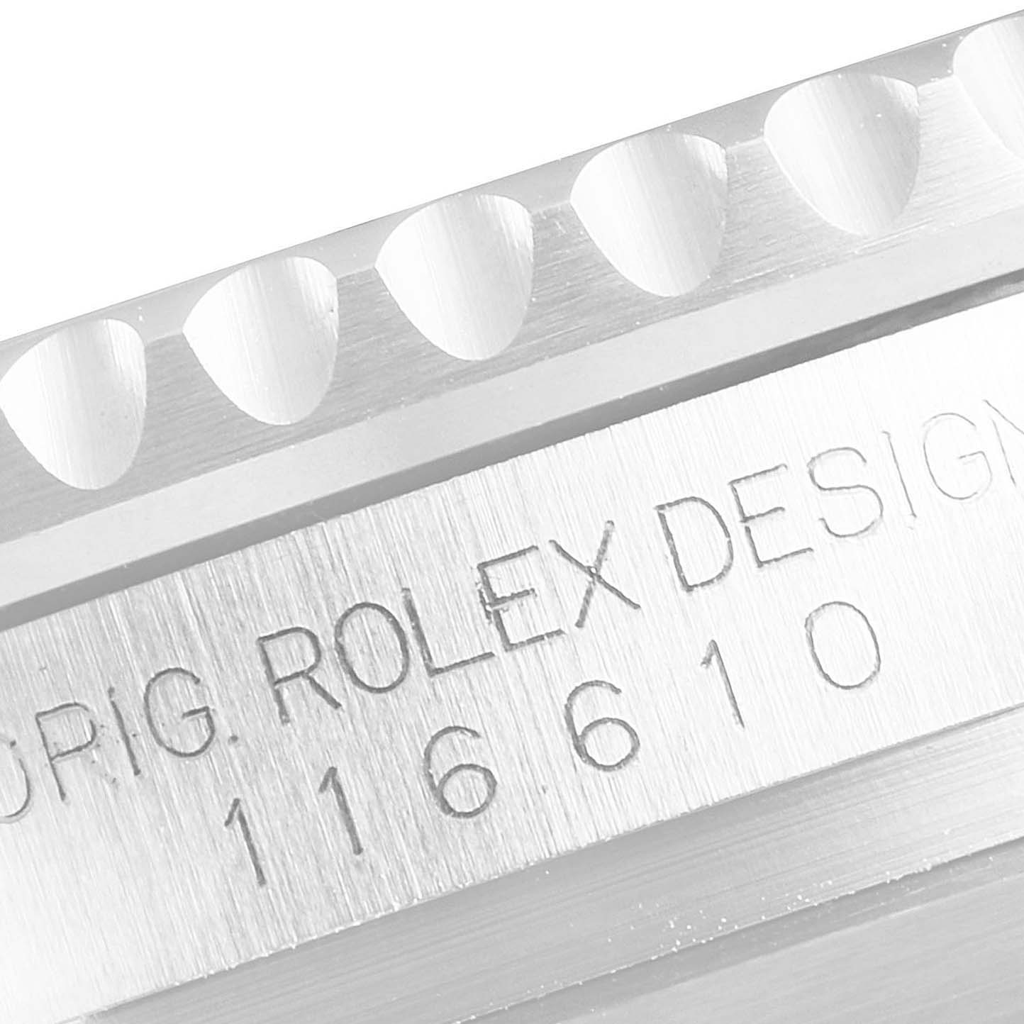 This image shows a close-up angle of the engraved bezel and case of a Rolex Submariner 116610LV Men
s Stainless Steel Green Dial 116610LV Men
s Stainless Steel Green Dial with the model number 116610.