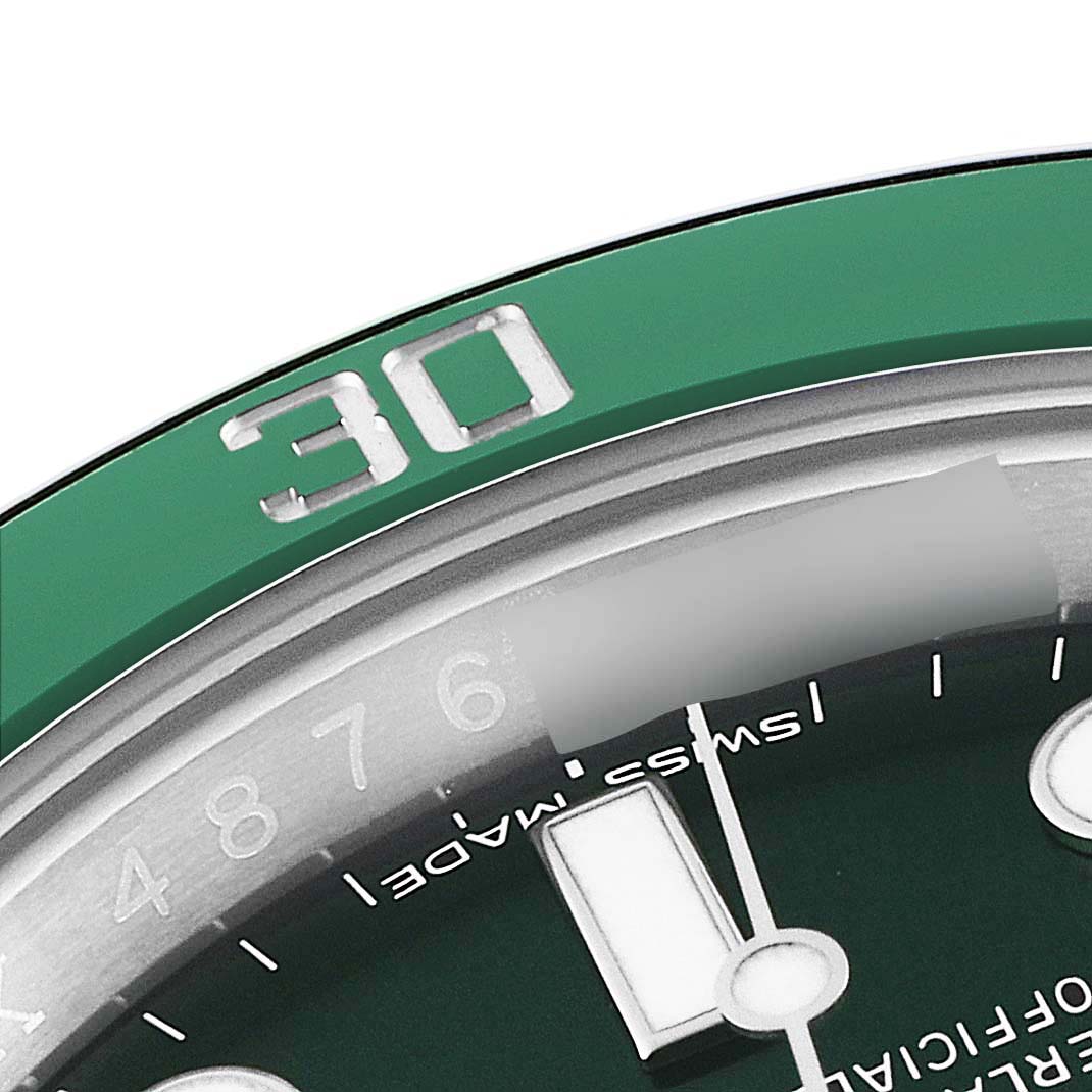 Close-up of a Rolex Submariner 116610LV Men
s Stainless Steel Green Dial 116610LV Men
s Stainless Steel Green Dial showing part of the green bezel with the "30" marker and the edge of the dial and hands.