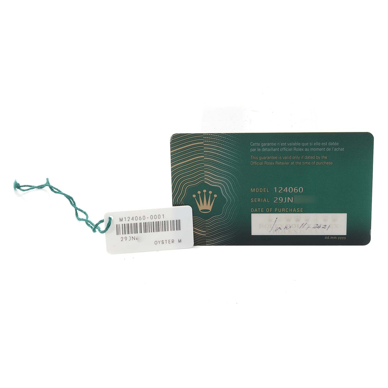 The image shows a warranty card and tag for a Rolex Submariner 124060 Men
s Stainless Steel Black Dial 124060 Men
s Stainless Steel Black Dial model 124060 watch.