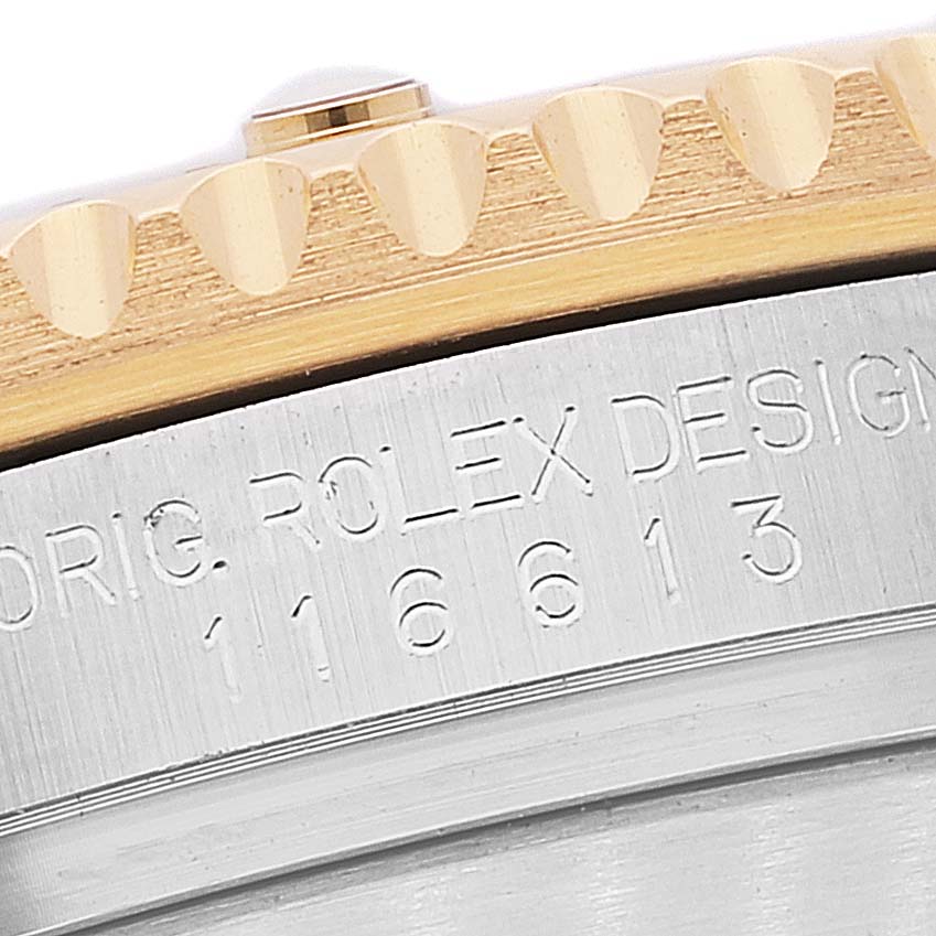 The image shows a close-up of the bezel and the engraved model number (16613) on a Rolex Submariner 116613 Men's Steel and Gold (two tone) Black Dial 116613 Men's Steel and Gold (two tone) Black Dial watch.